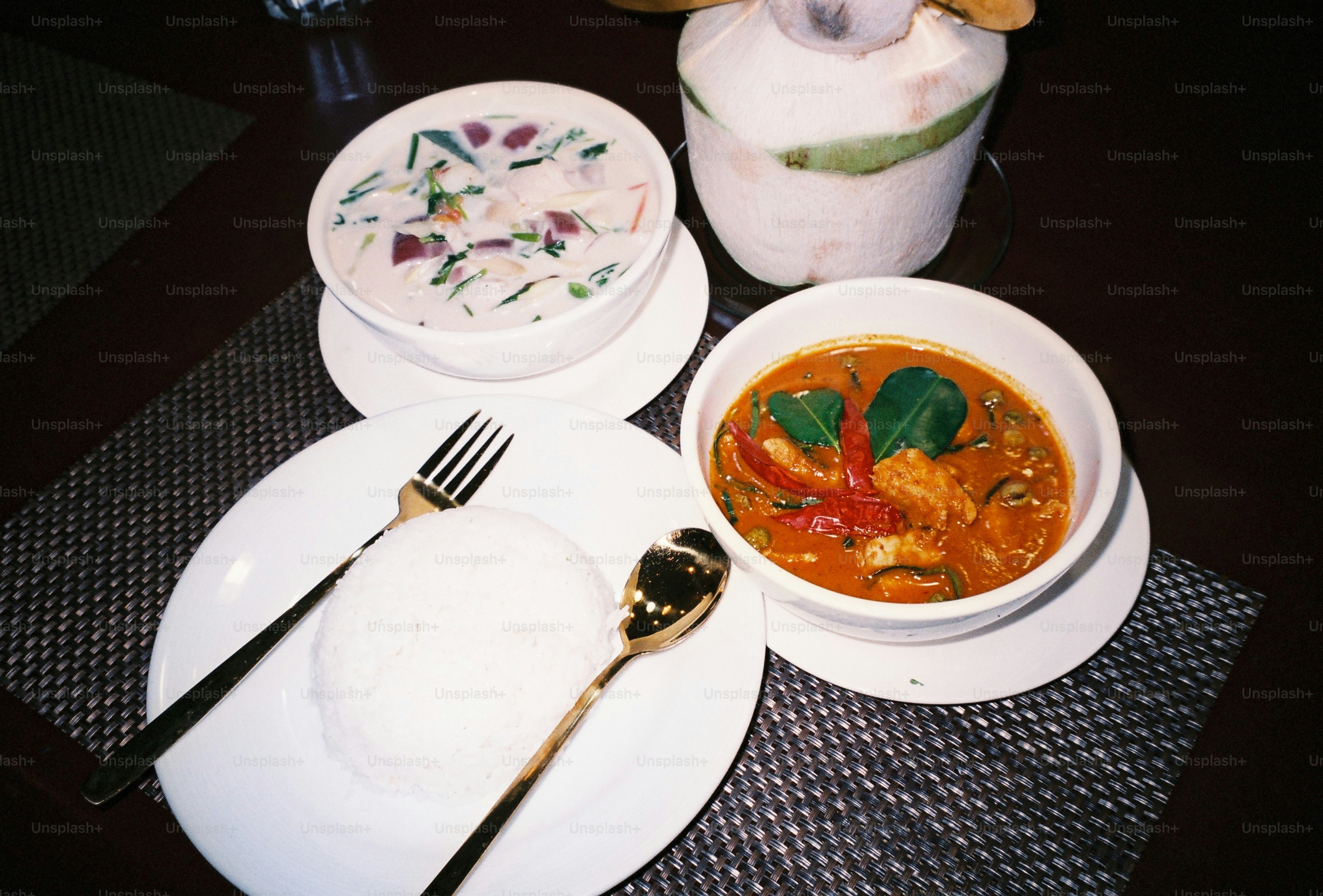 Thai curry dinner with white rice - Photo on Unsplash+