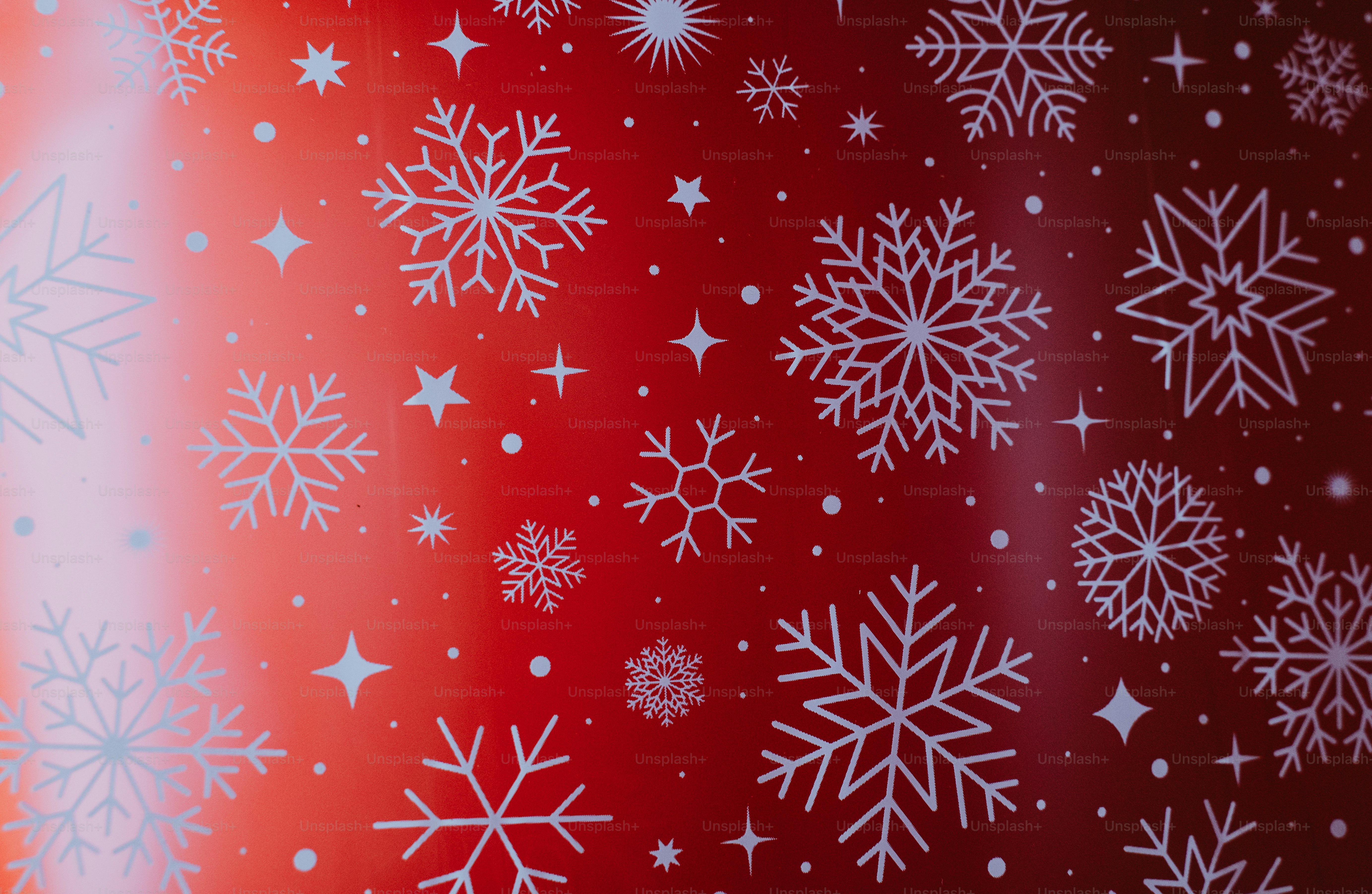 White snowflake pattern on red - Photo on Unsplash+