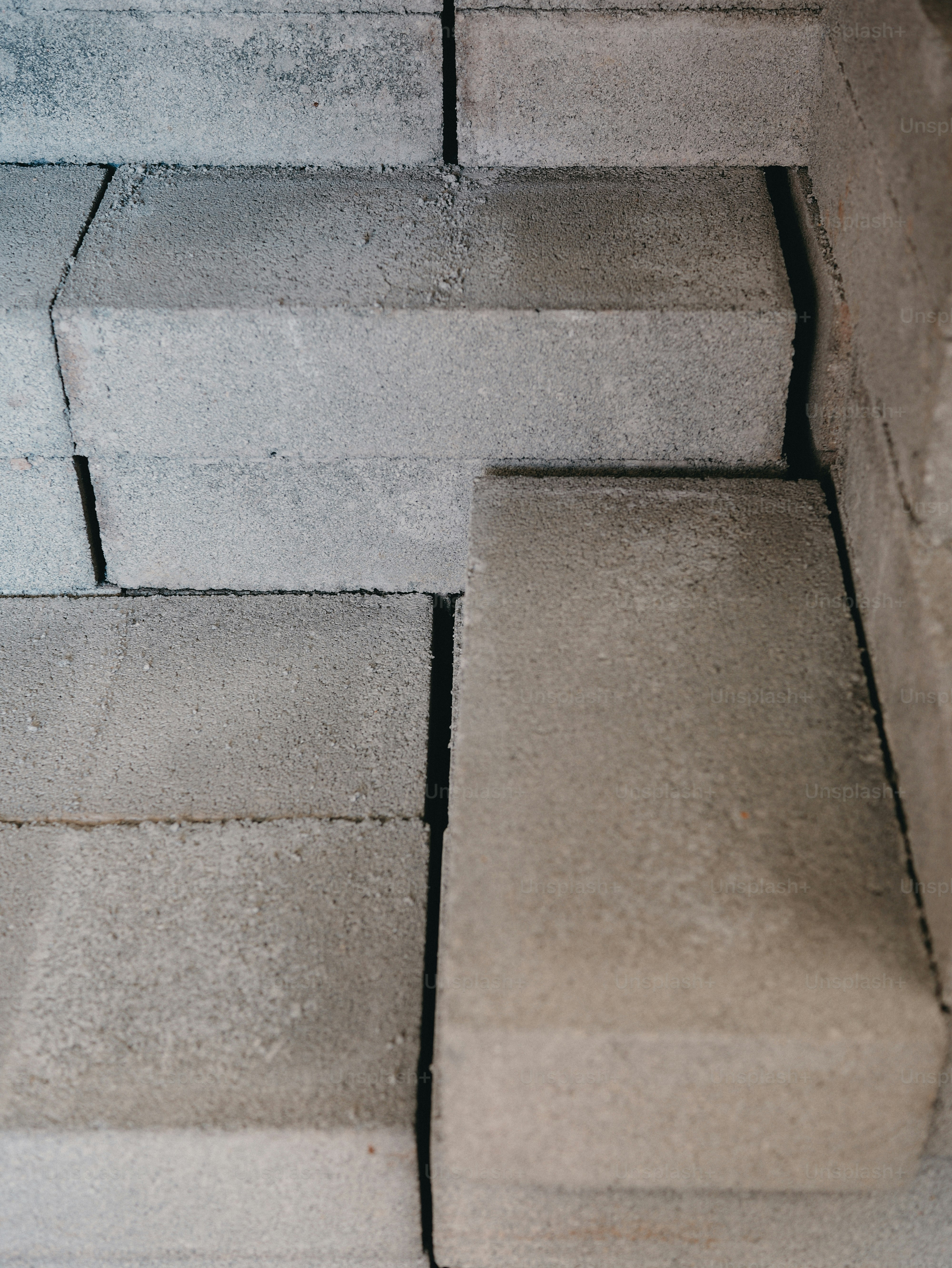 Stacked grey concrete bricks corner - Photo on Unsplash+