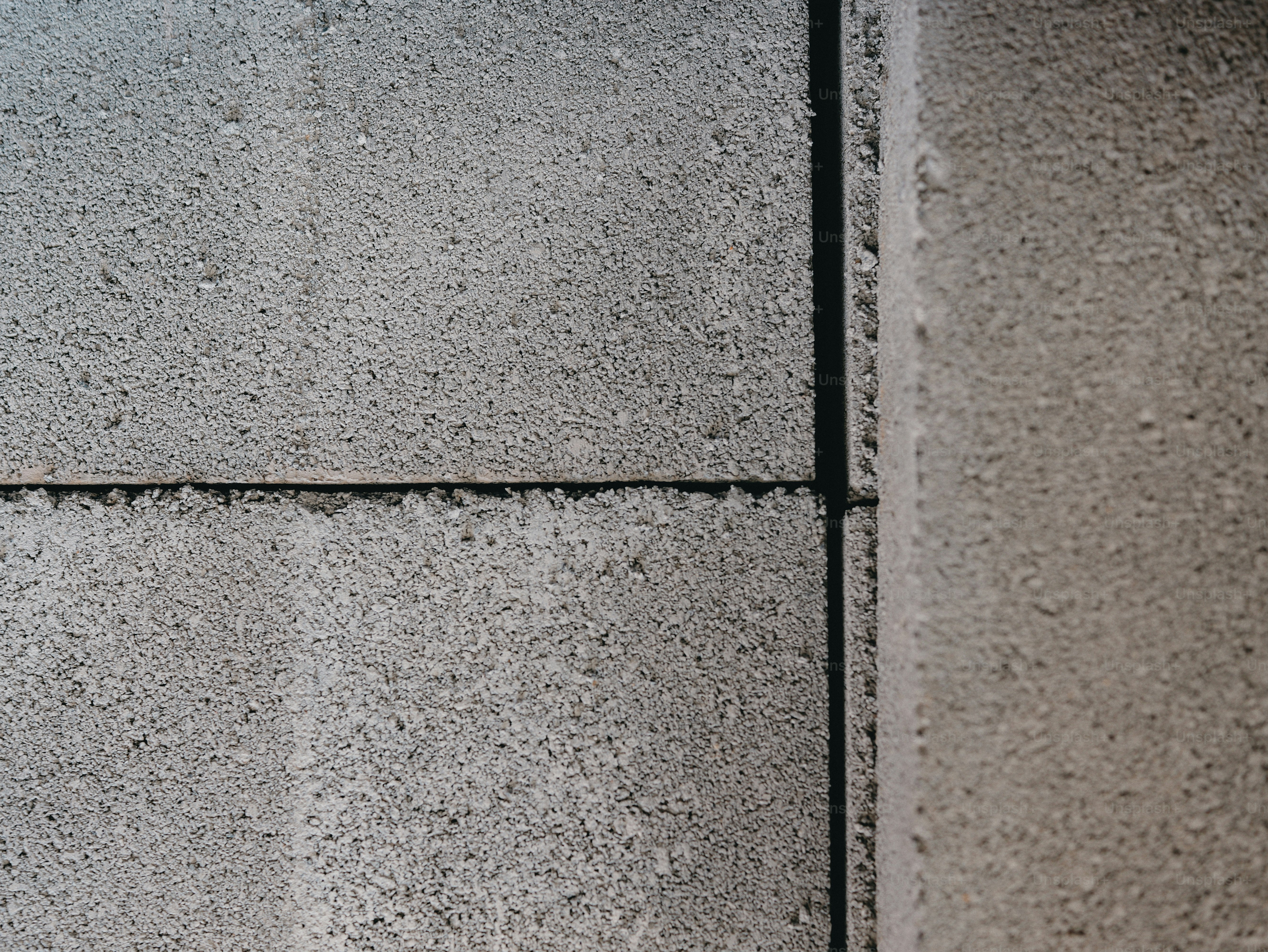 Stacked grey concrete bricks corner - Photo on Unsplash+