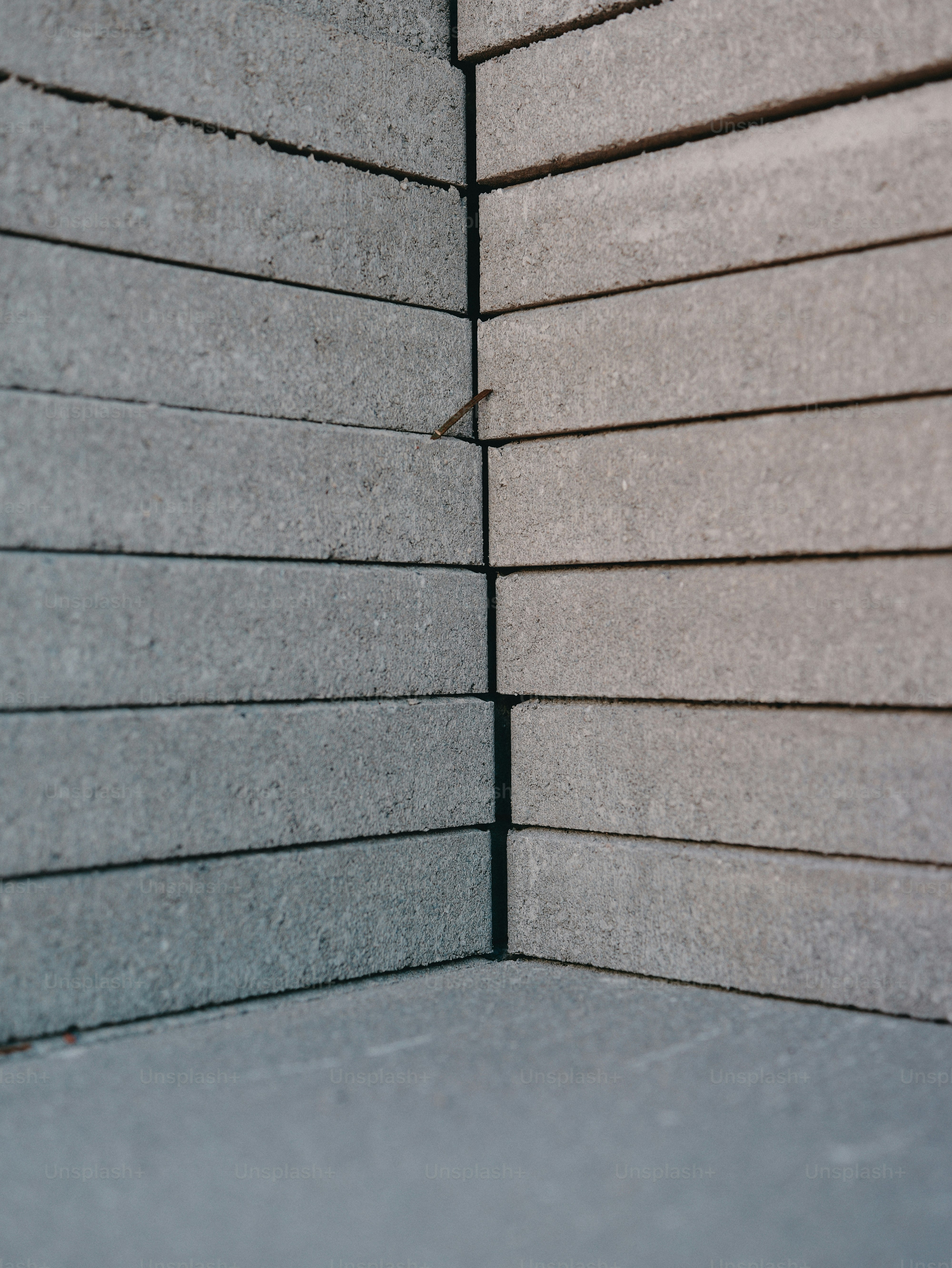Stacked grey concrete bricks corner - Photo on Unsplash+