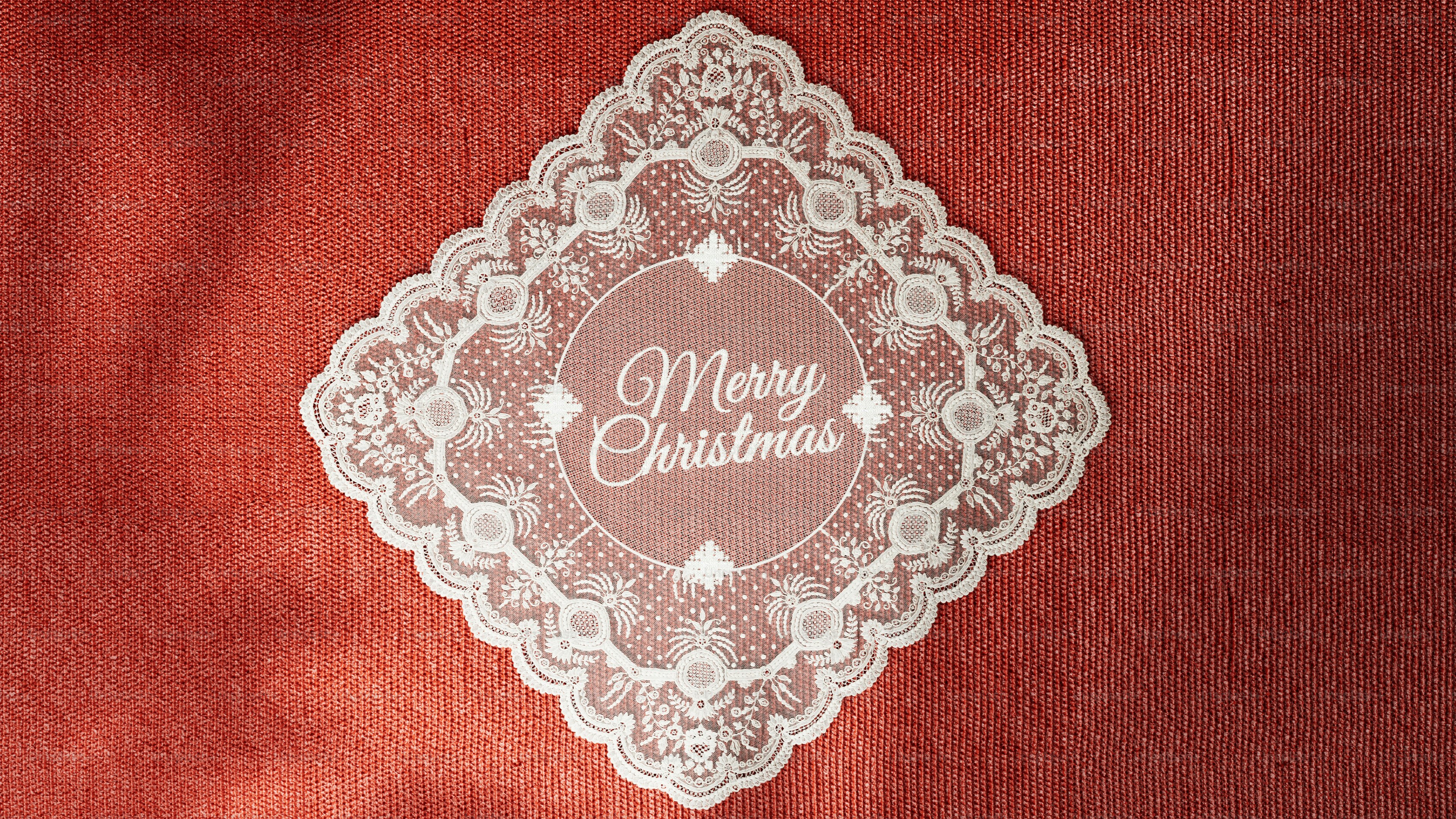 White lace doily on red background - Photo on Unsplash+