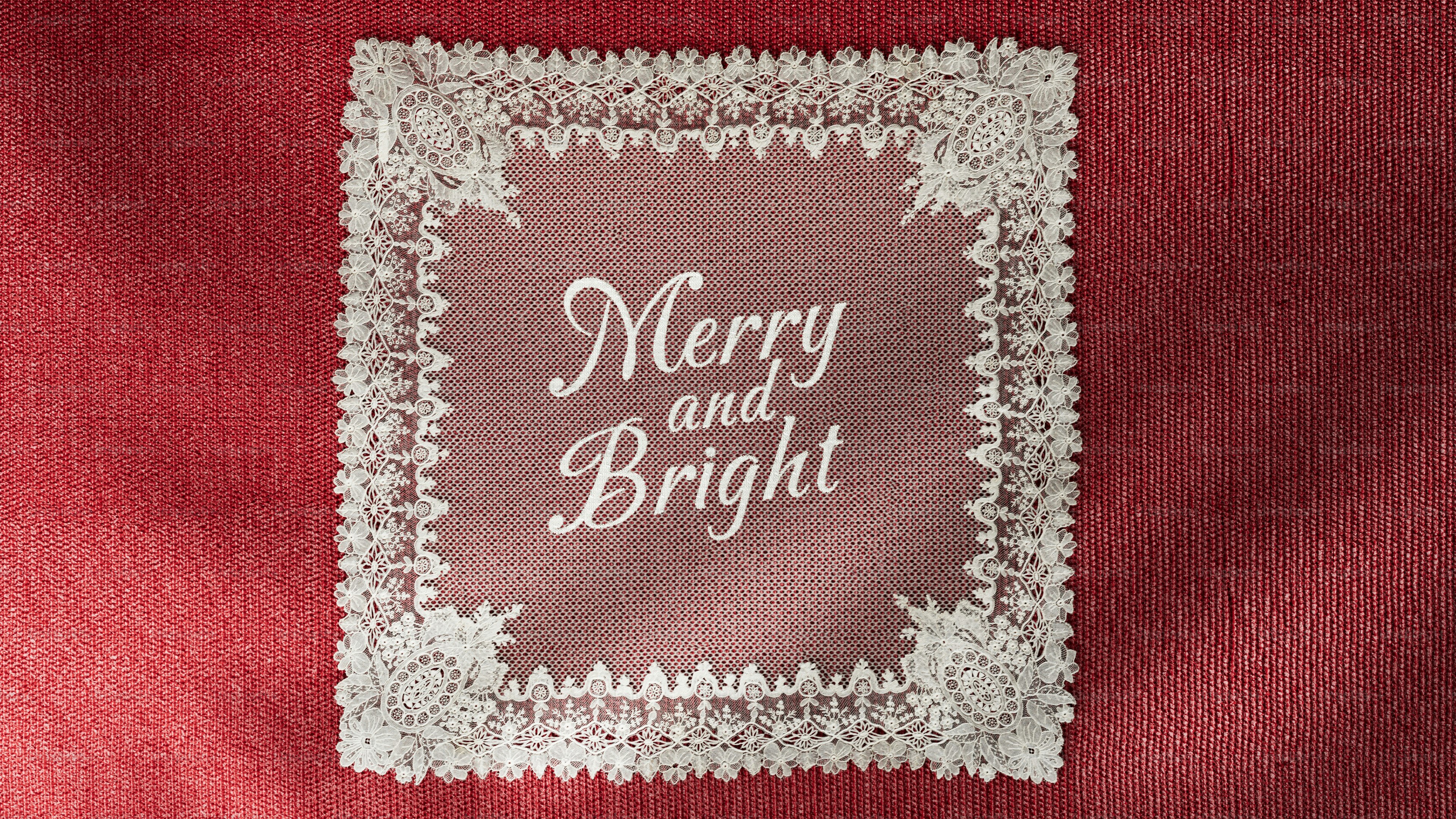 White lace doily on red background - Photo on Unsplash+