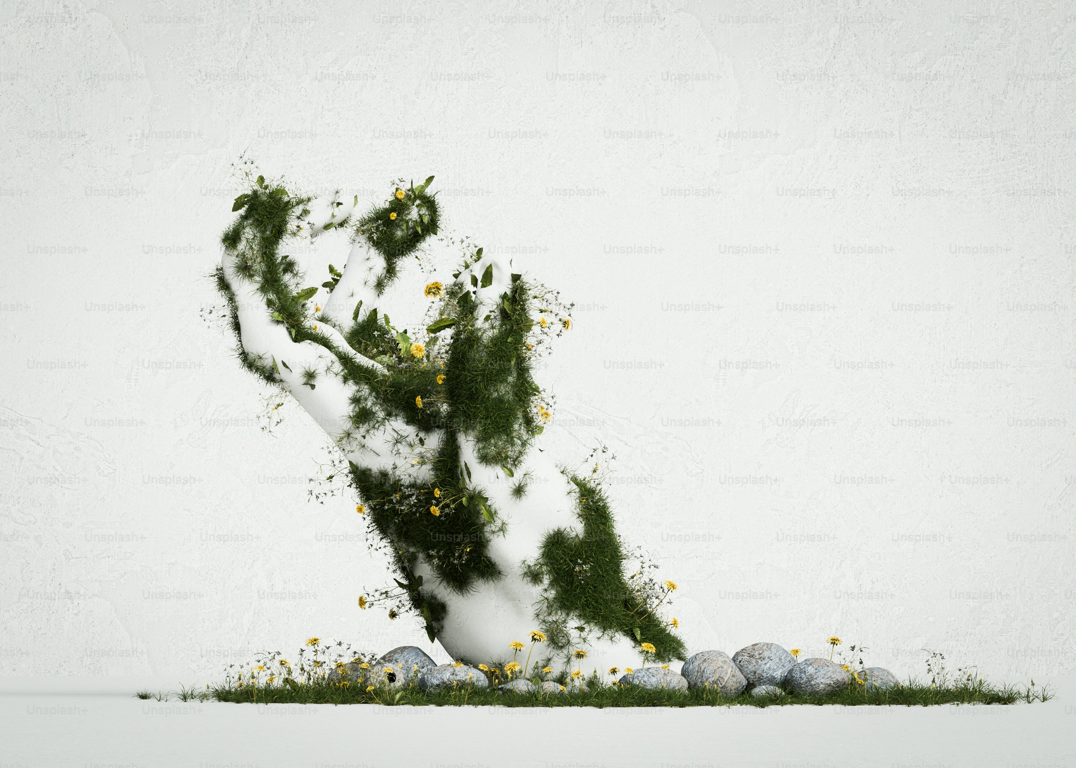 White hand sculpture with moss - Photo on Unsplash+