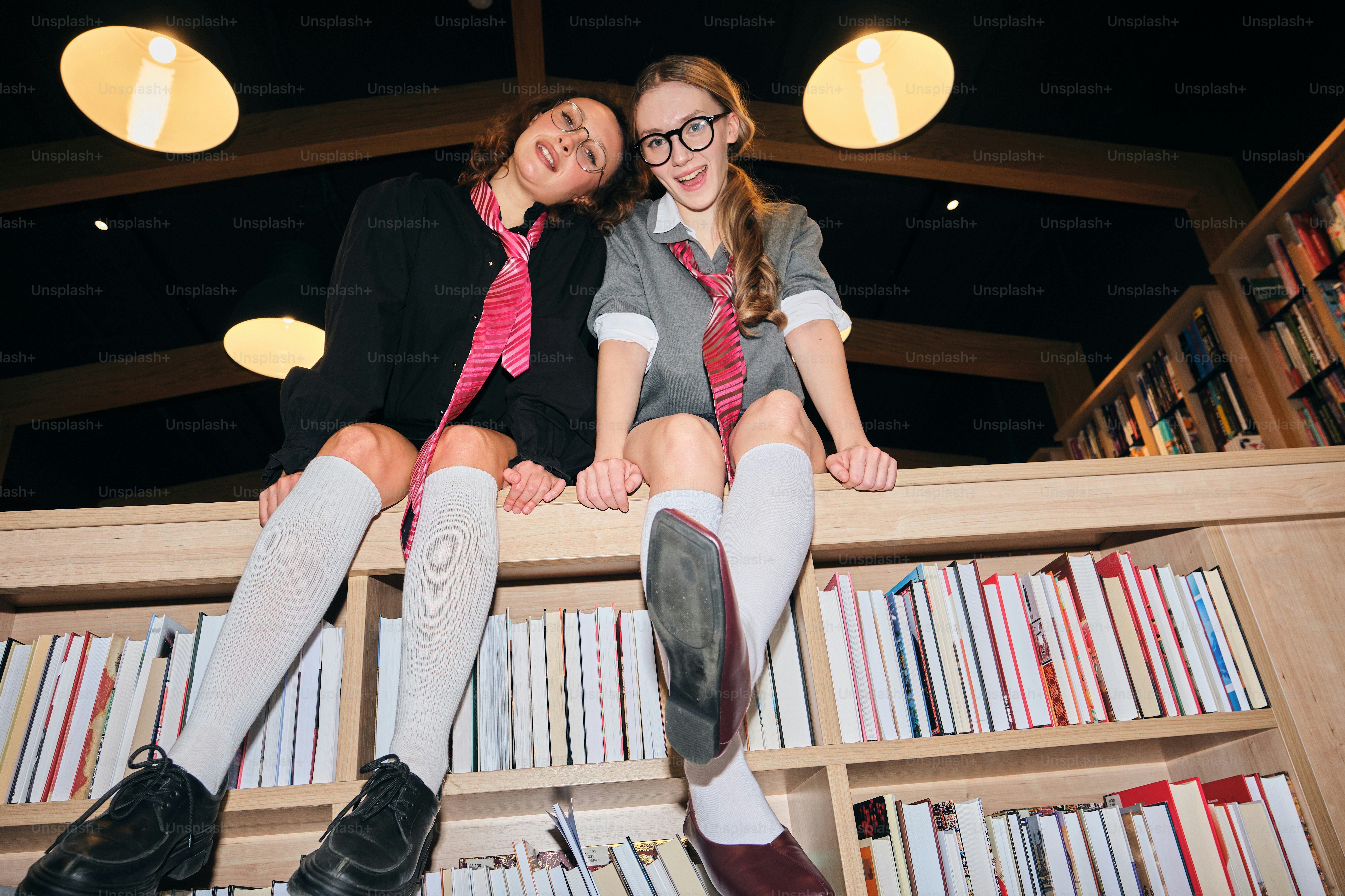 Students in school uniforms in library - Photo on Unsplash+