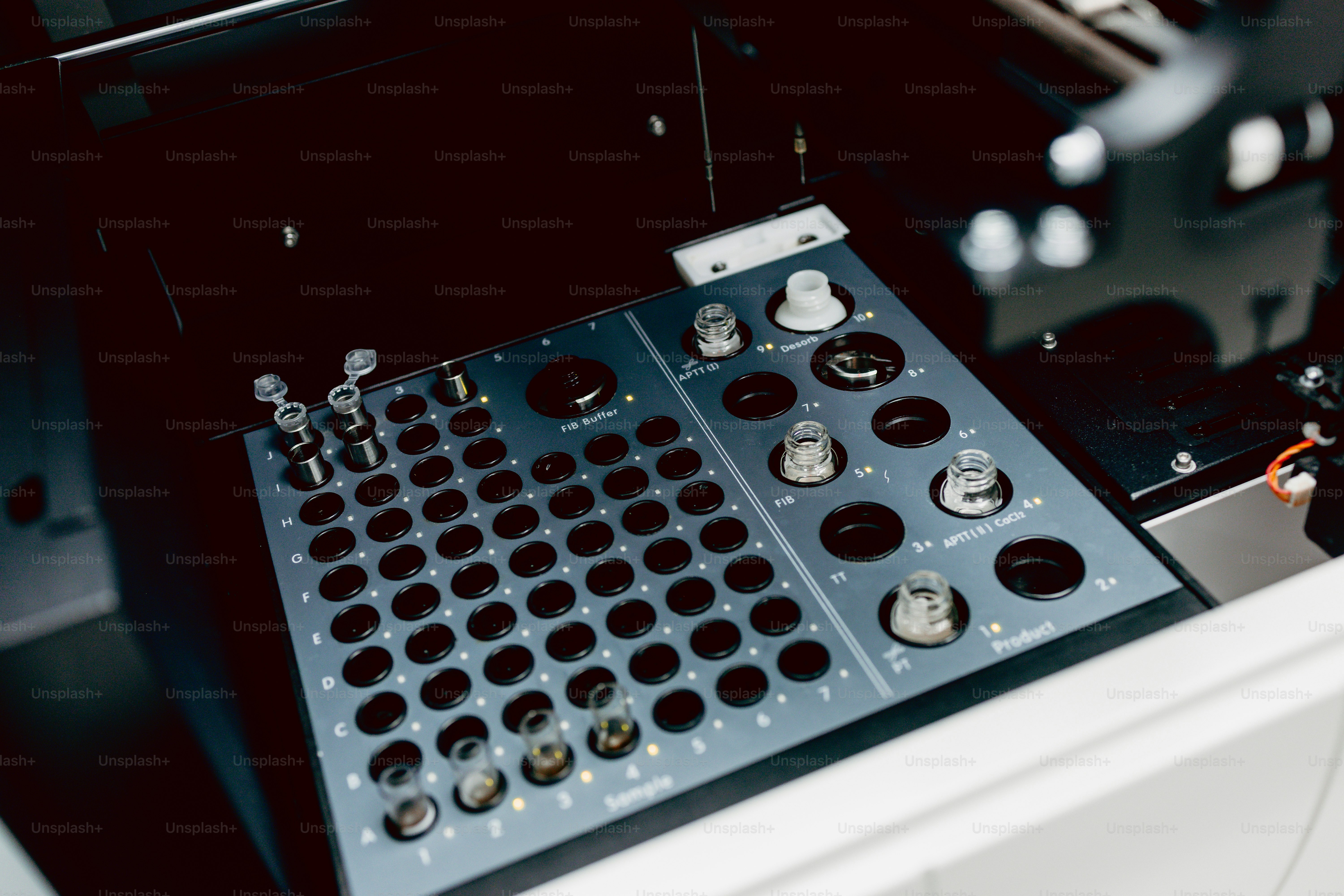 Coagulometer sample tray with glass vials - Photo on Unsplash+