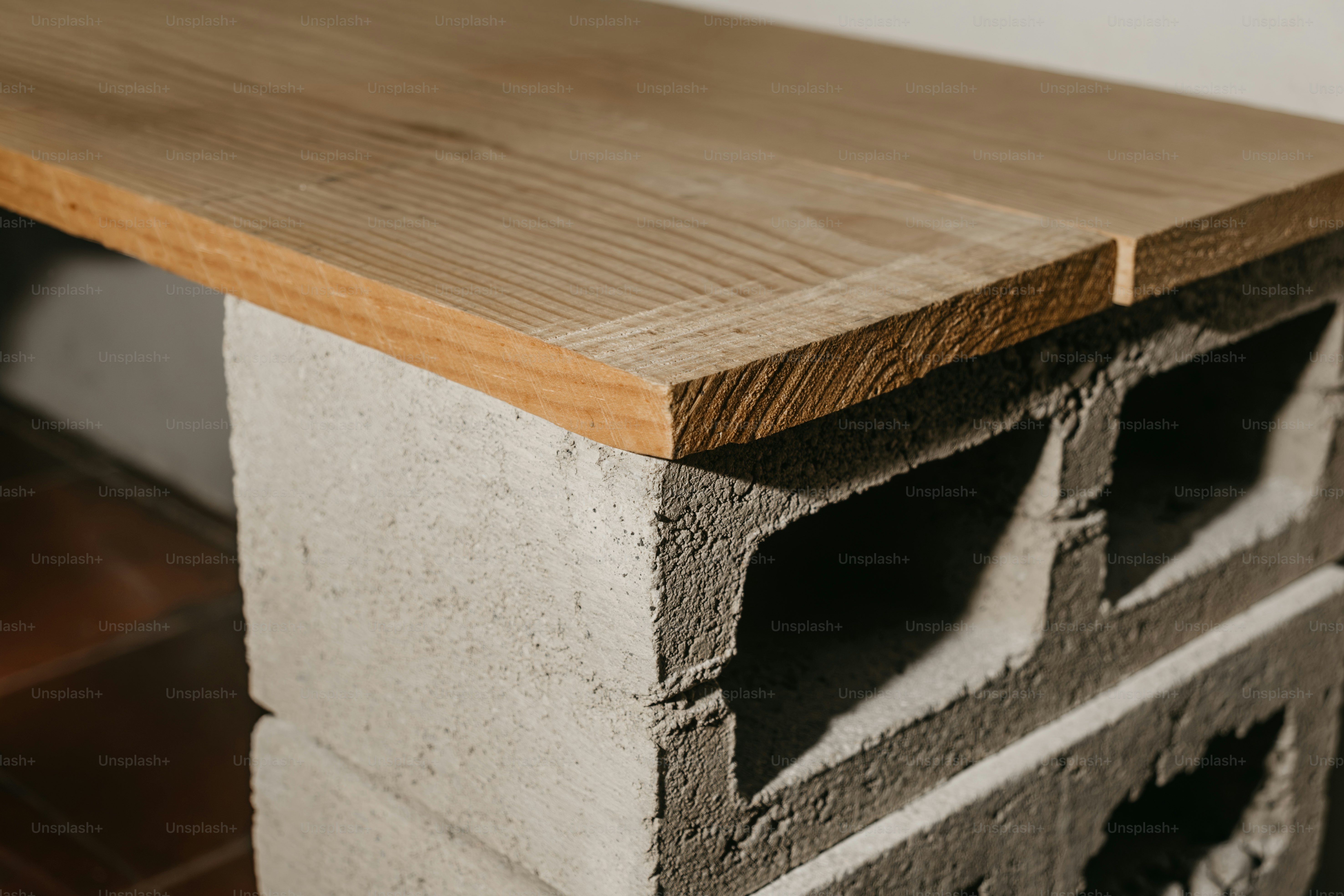 Wooden plank on concrete blocks - Photo on Unsplash+