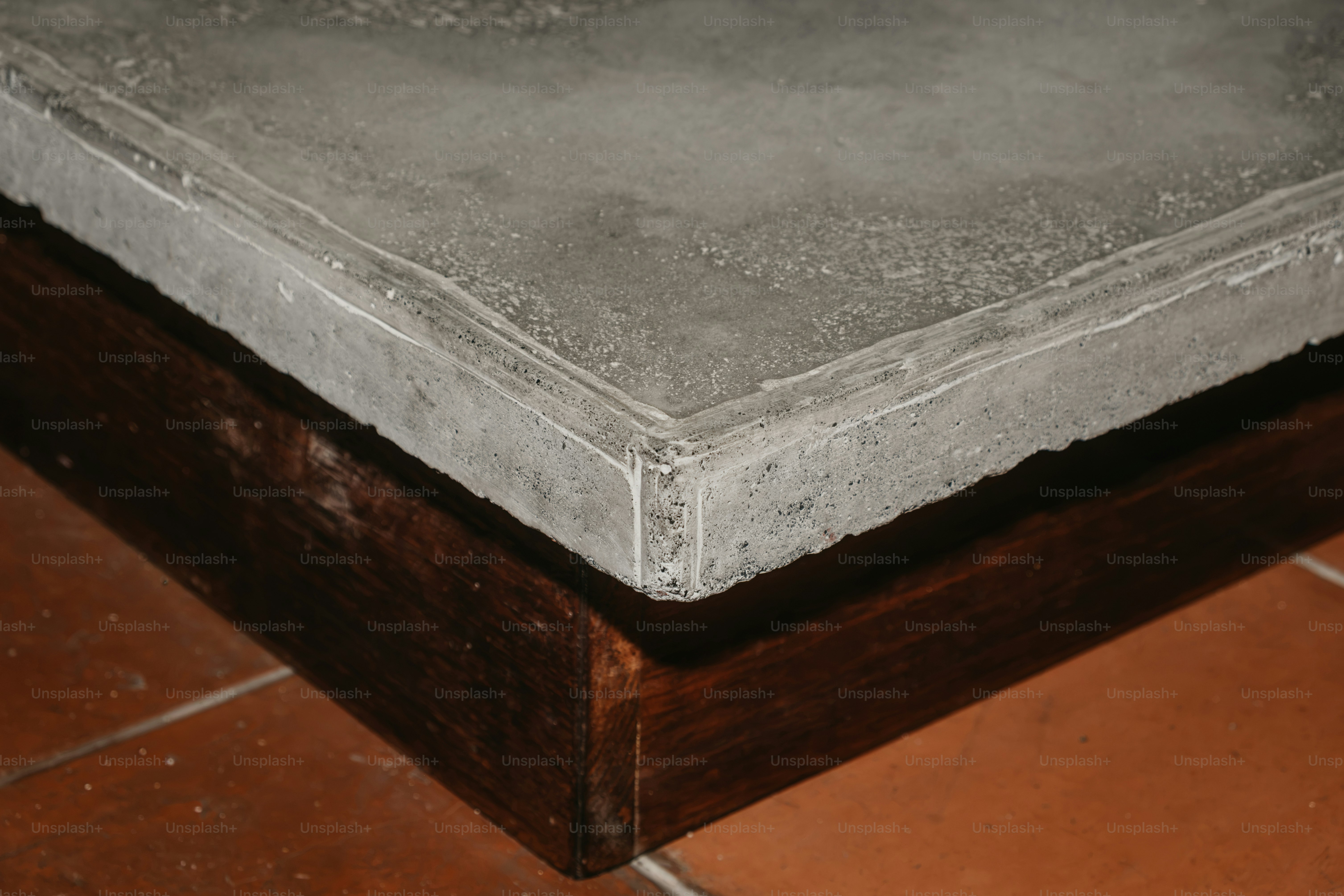 Three rough concrete blocks - Photo on Unsplash+