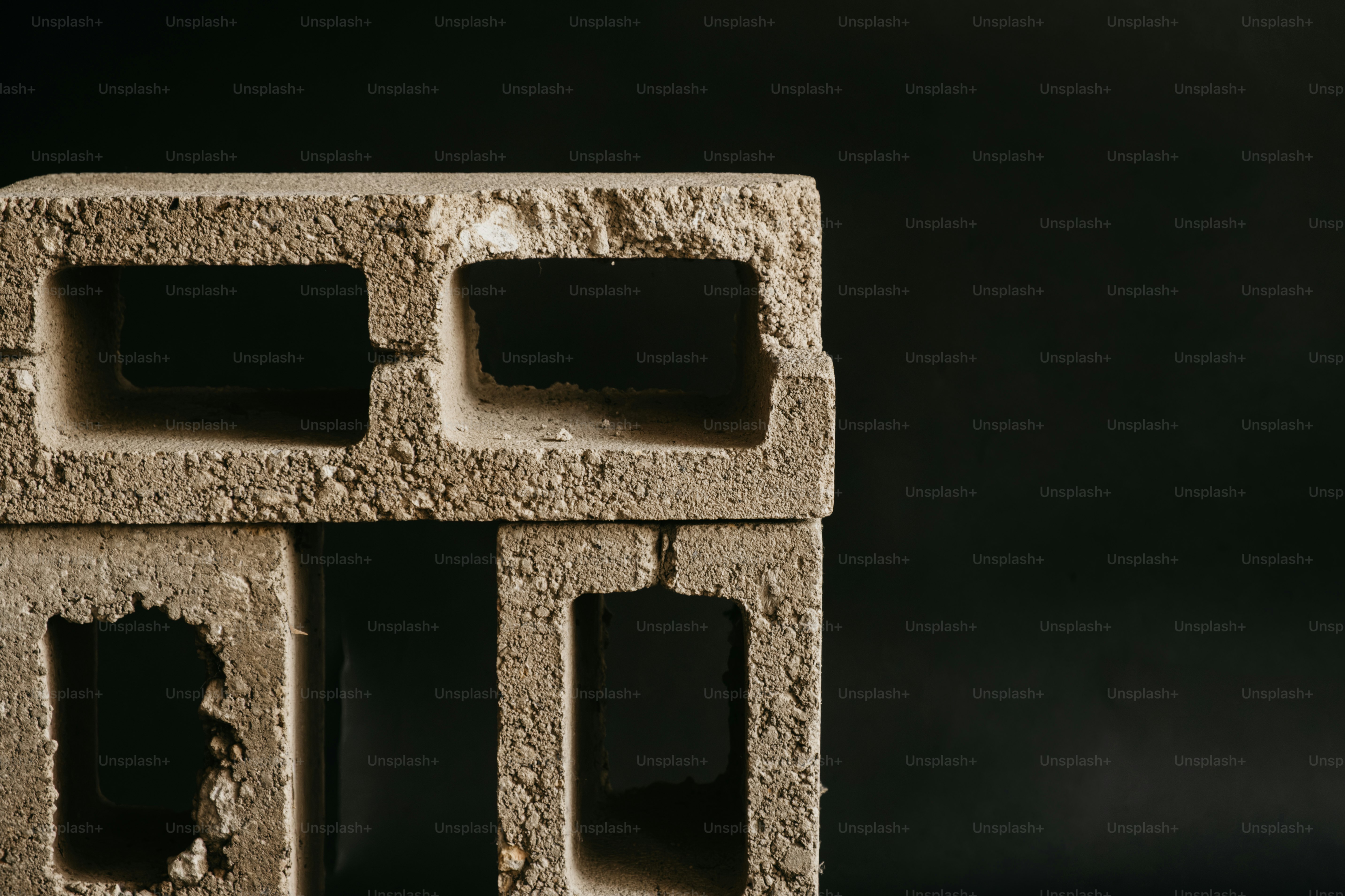 Three rough concrete blocks - Photo on Unsplash+