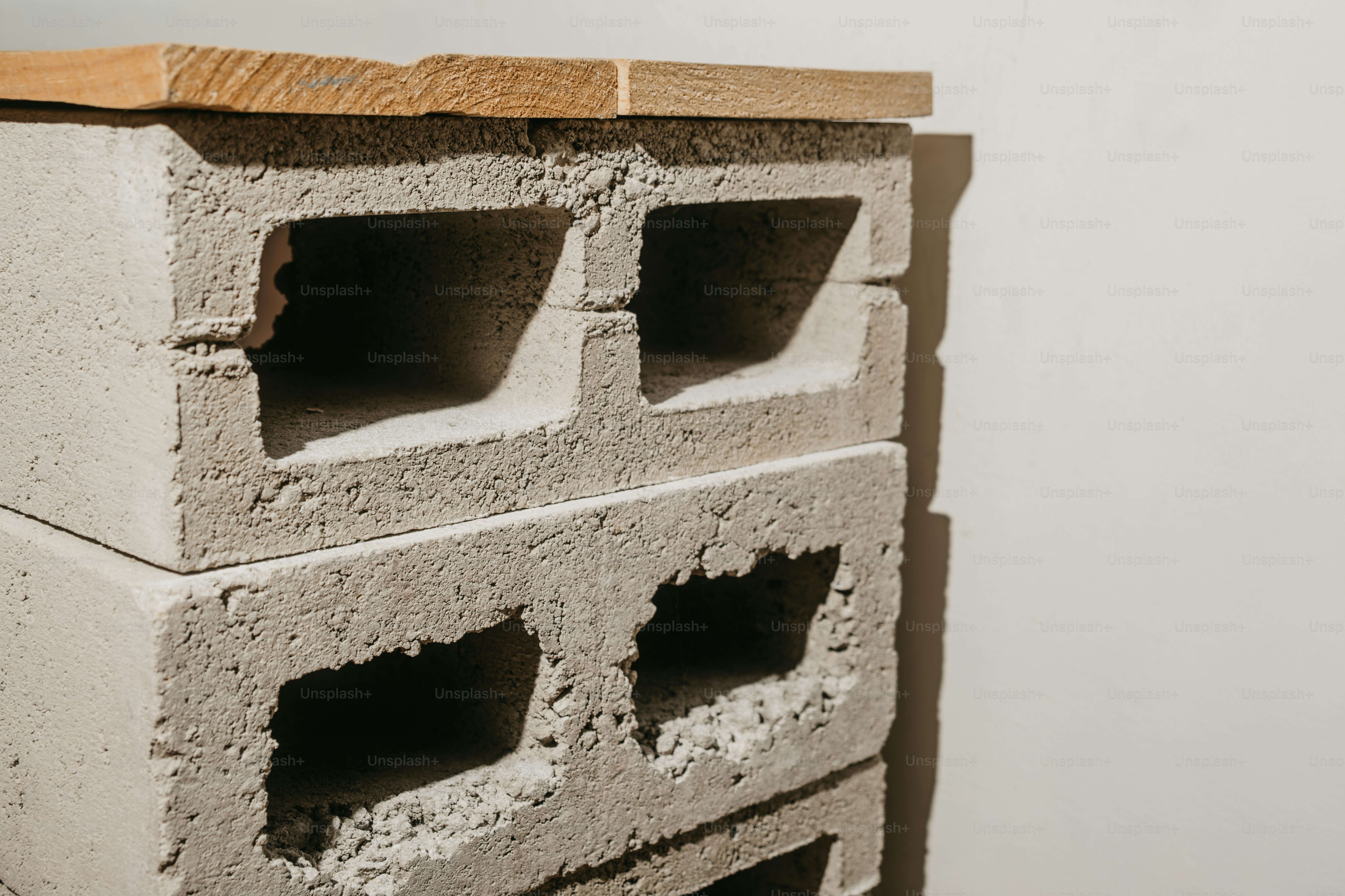 Wooden plank on concrete blocks - Photo on Unsplash+