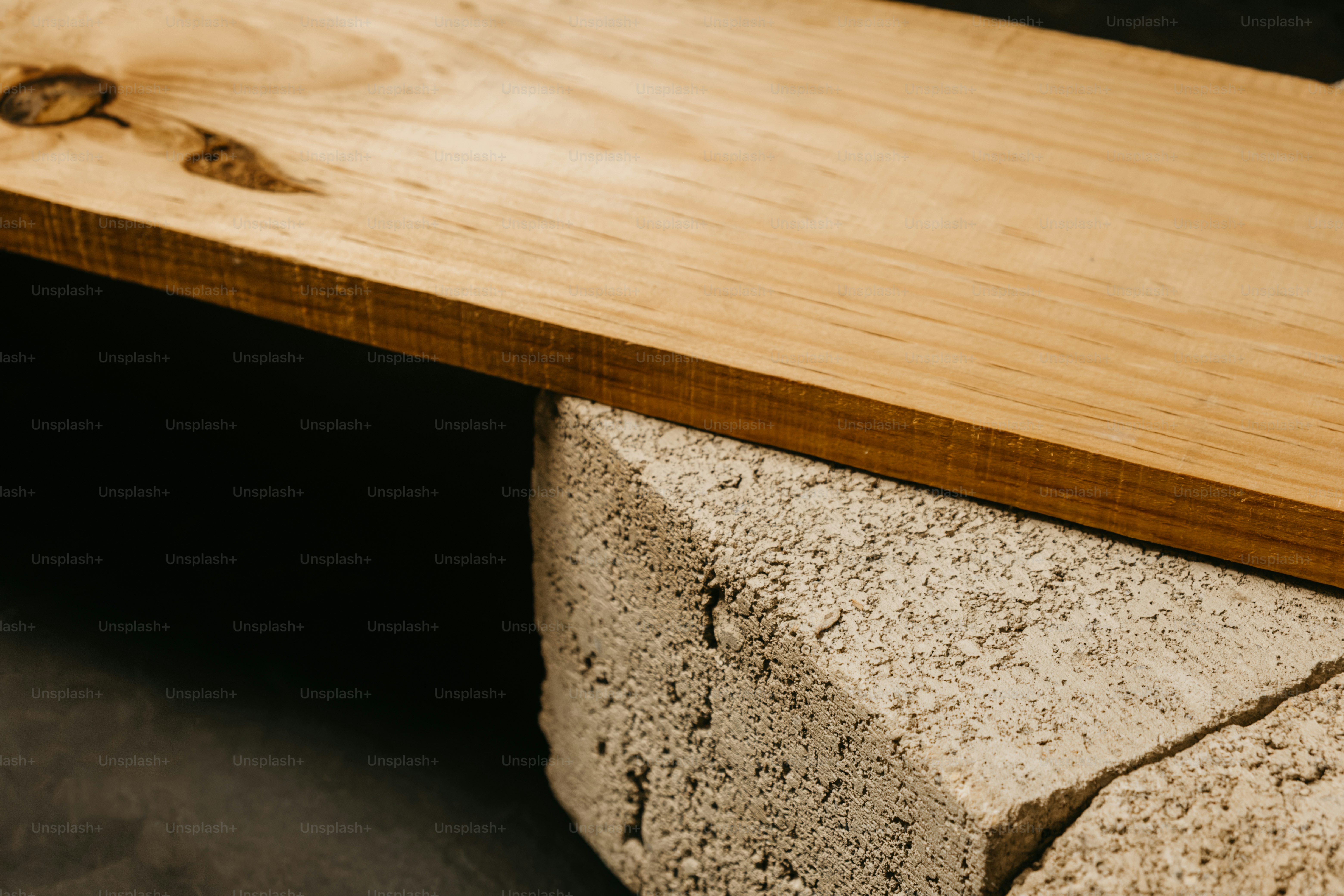 Rough concrete block with hollow openings - Photo on Unsplash+