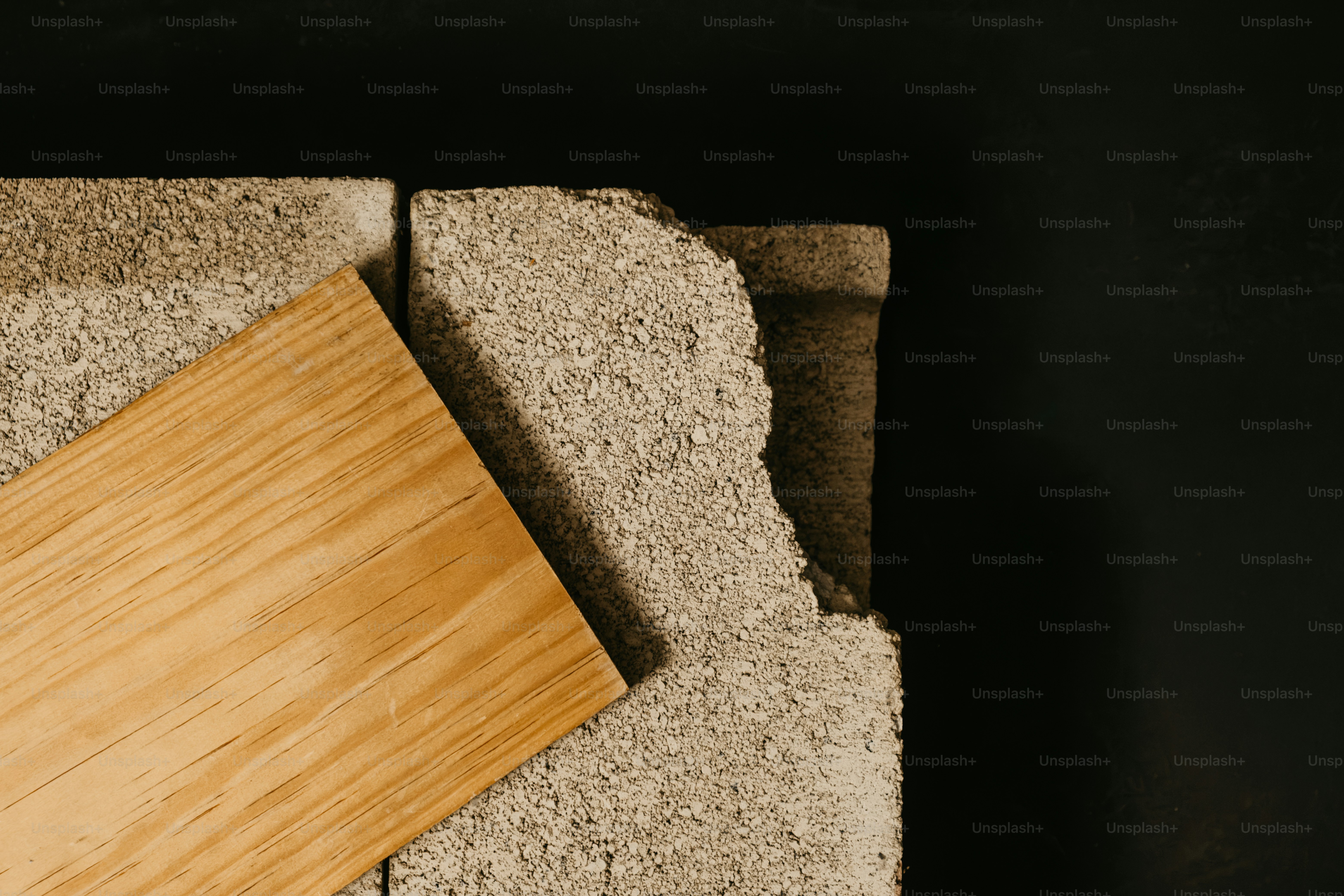 Three rough concrete blocks - Photo on Unsplash+