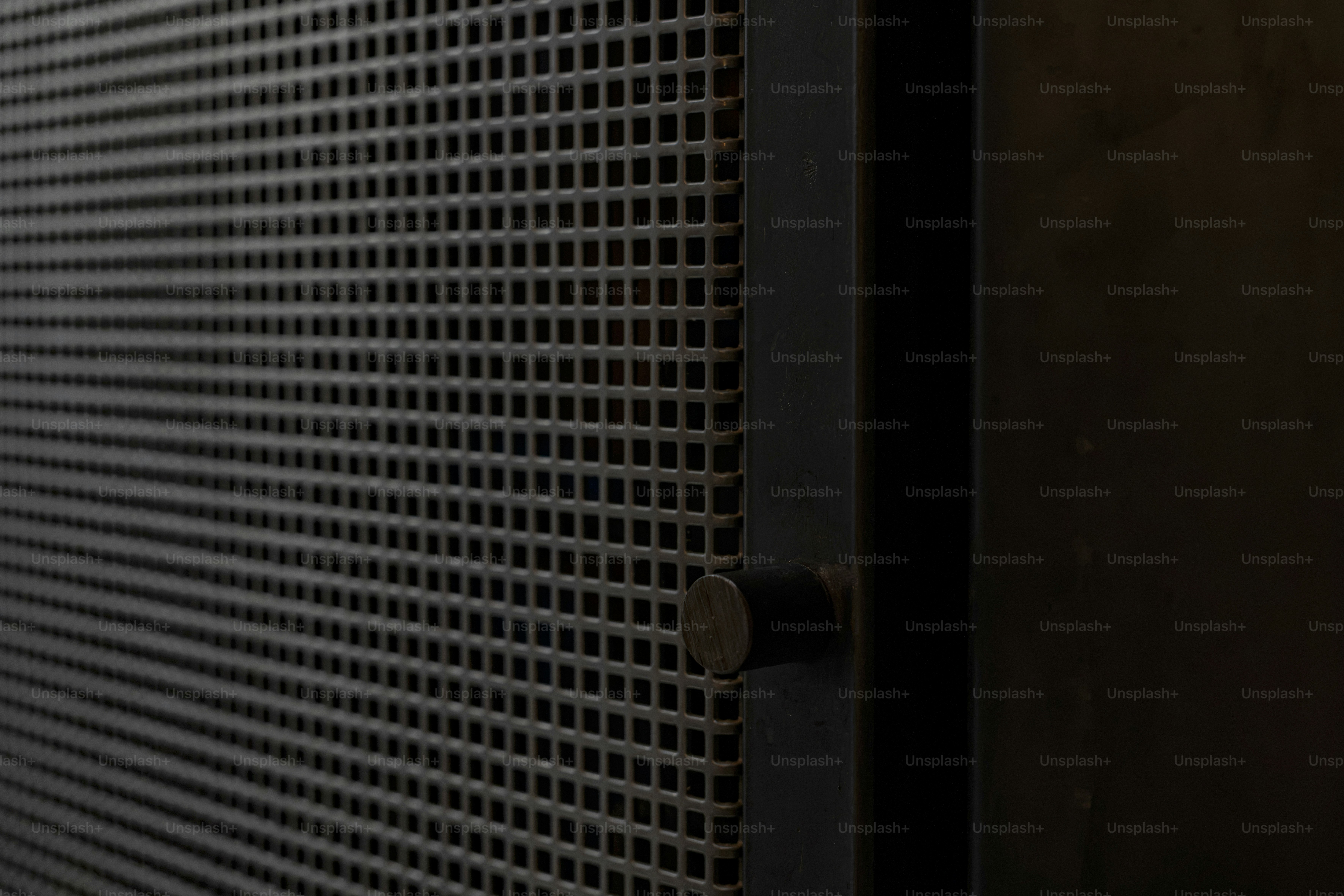 Dark metal panel with rivets - Photo on Unsplash+