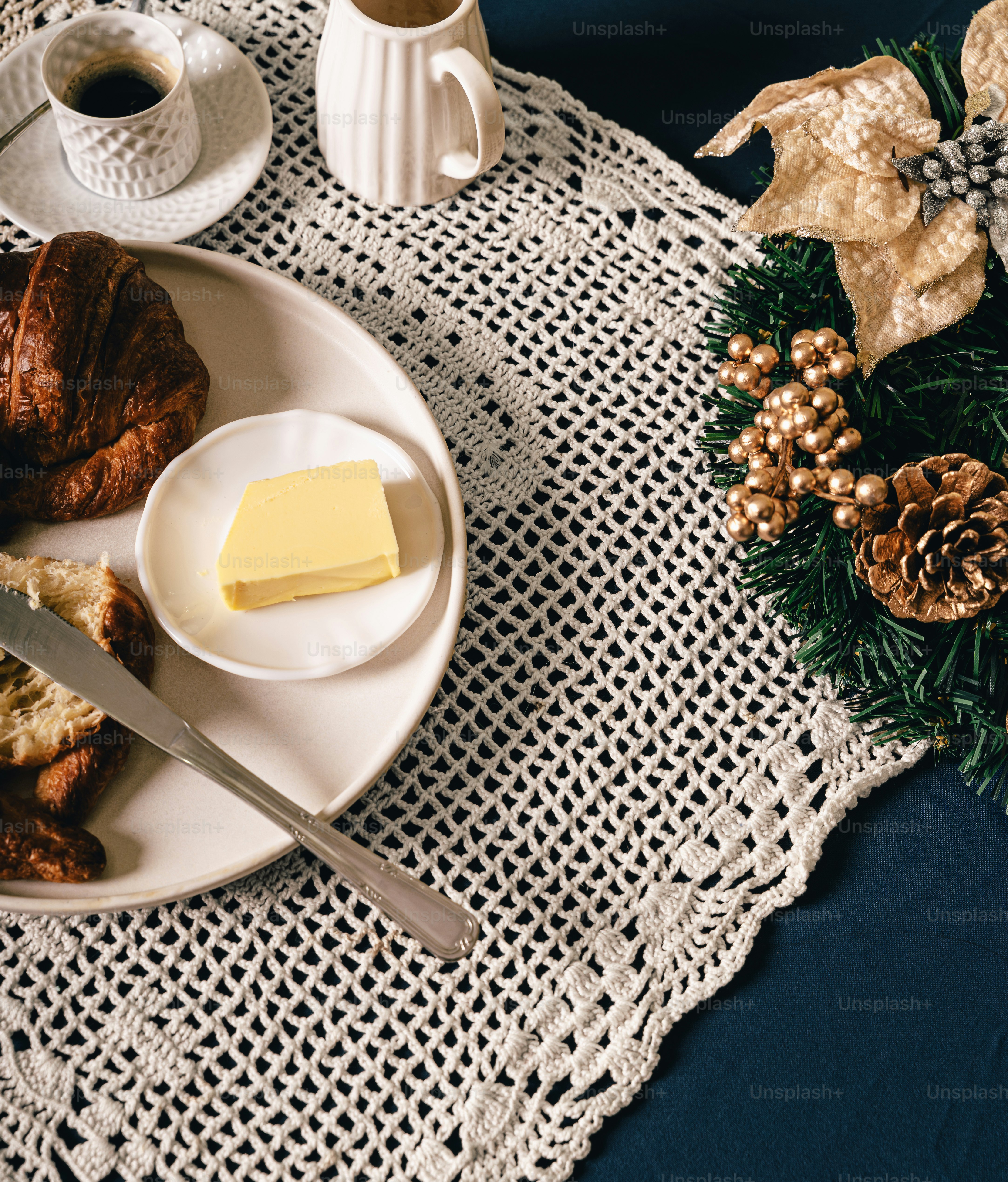 Croissant with butter and holiday breakfast - Photo on Unsplash+