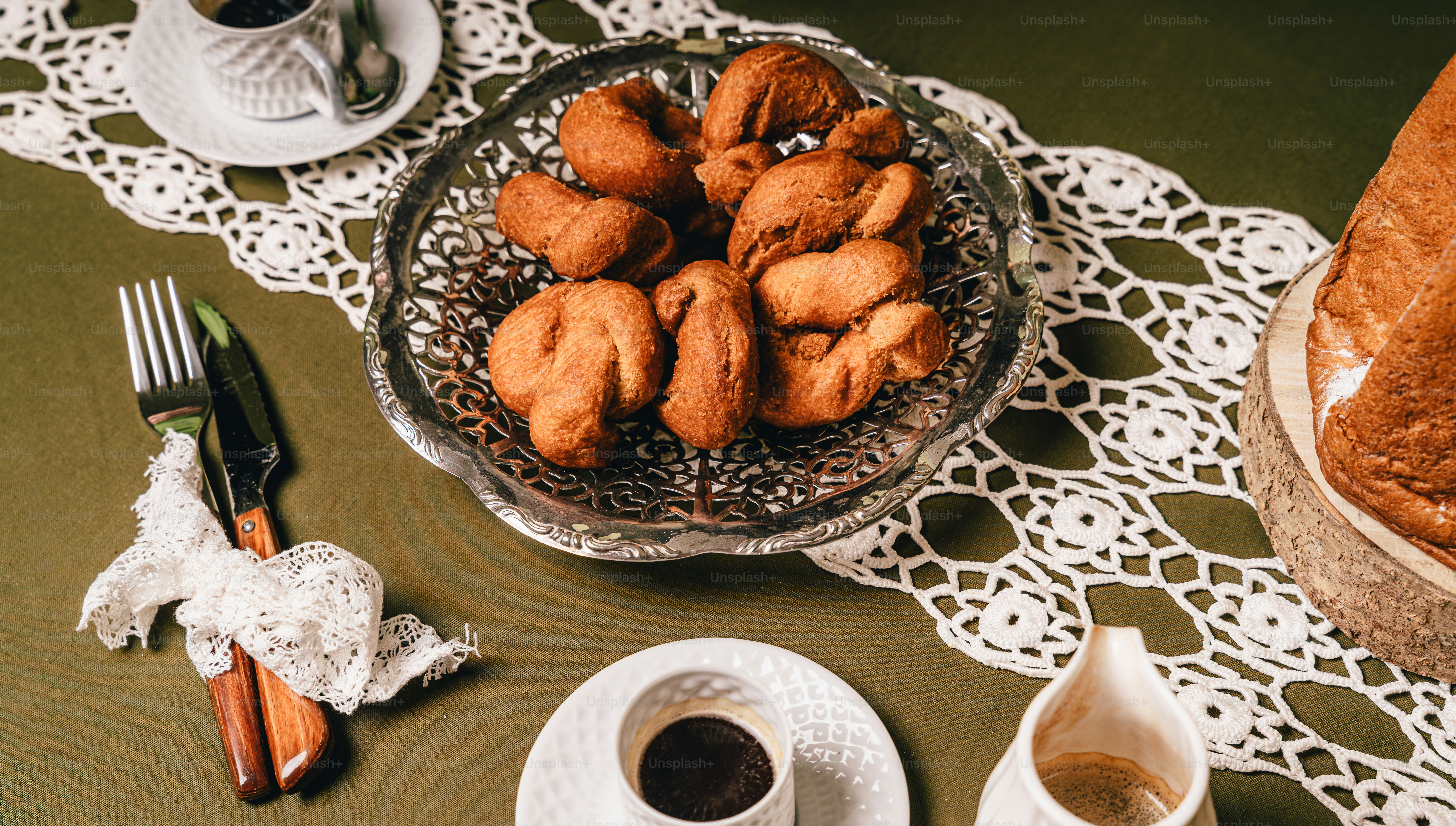Fried dough knots on silver platter - Photo on Unsplash+
