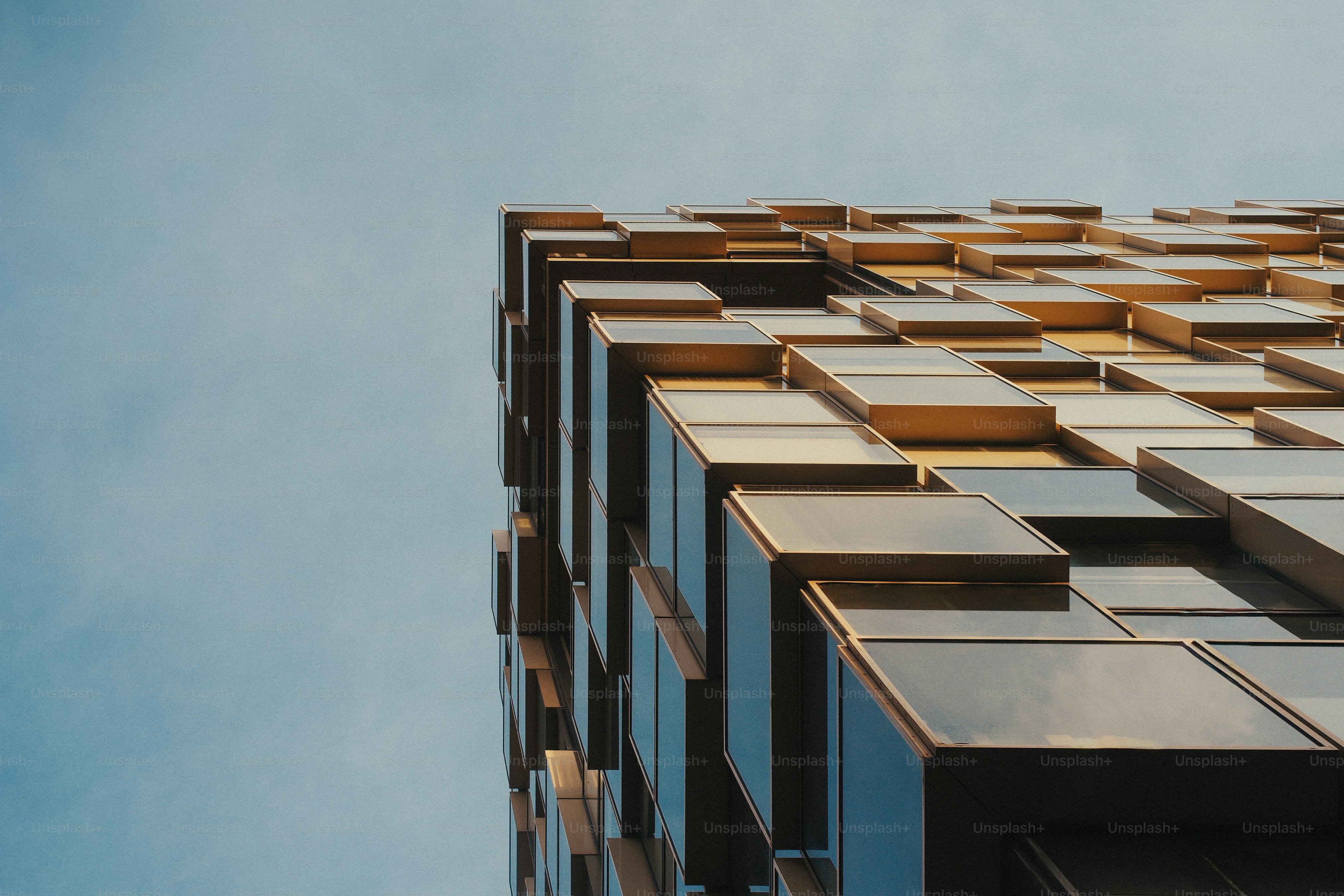 Modern building with golden glass windows - Photo on Unsplash+