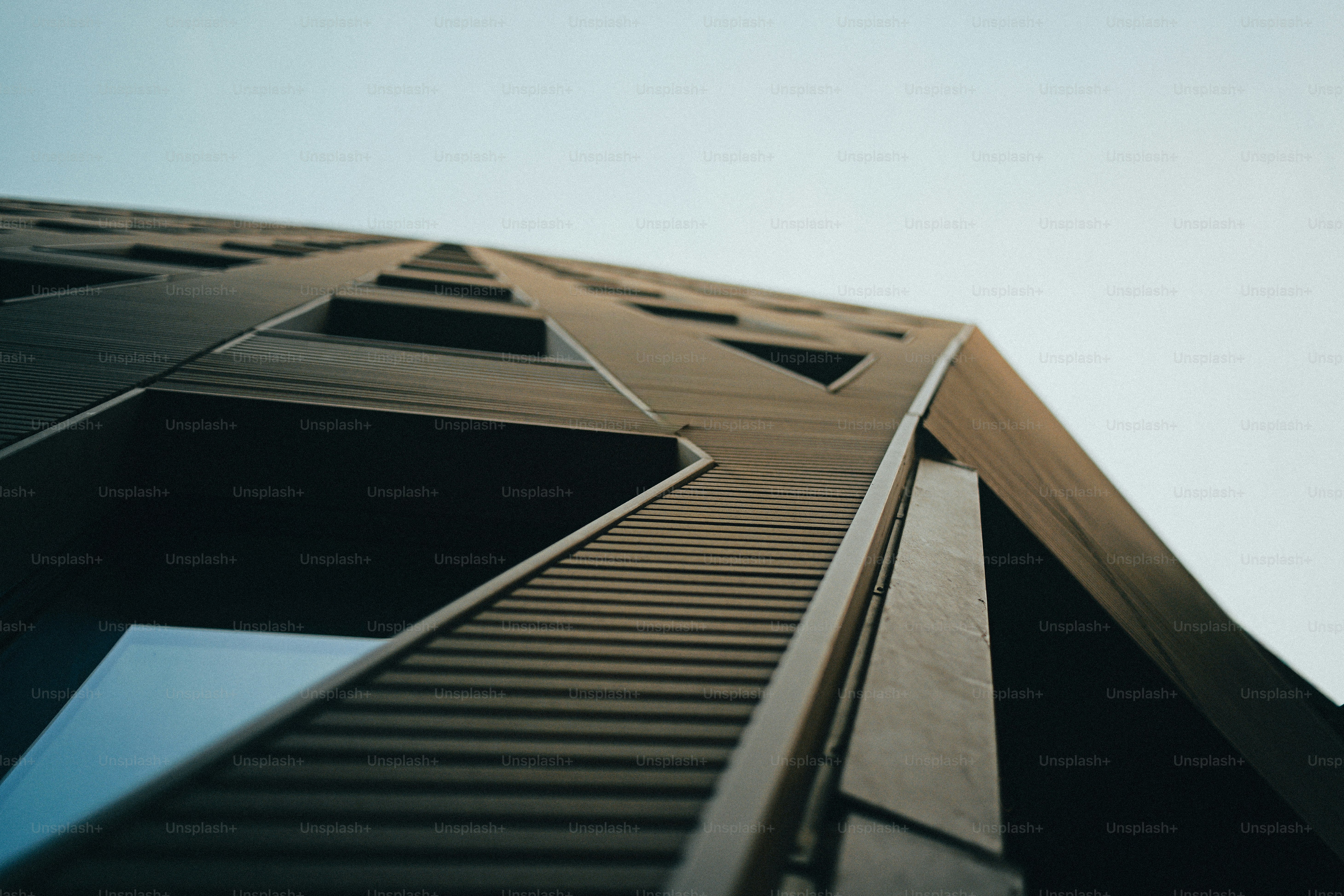 Modern building with golden glass windows - Photo on Unsplash+