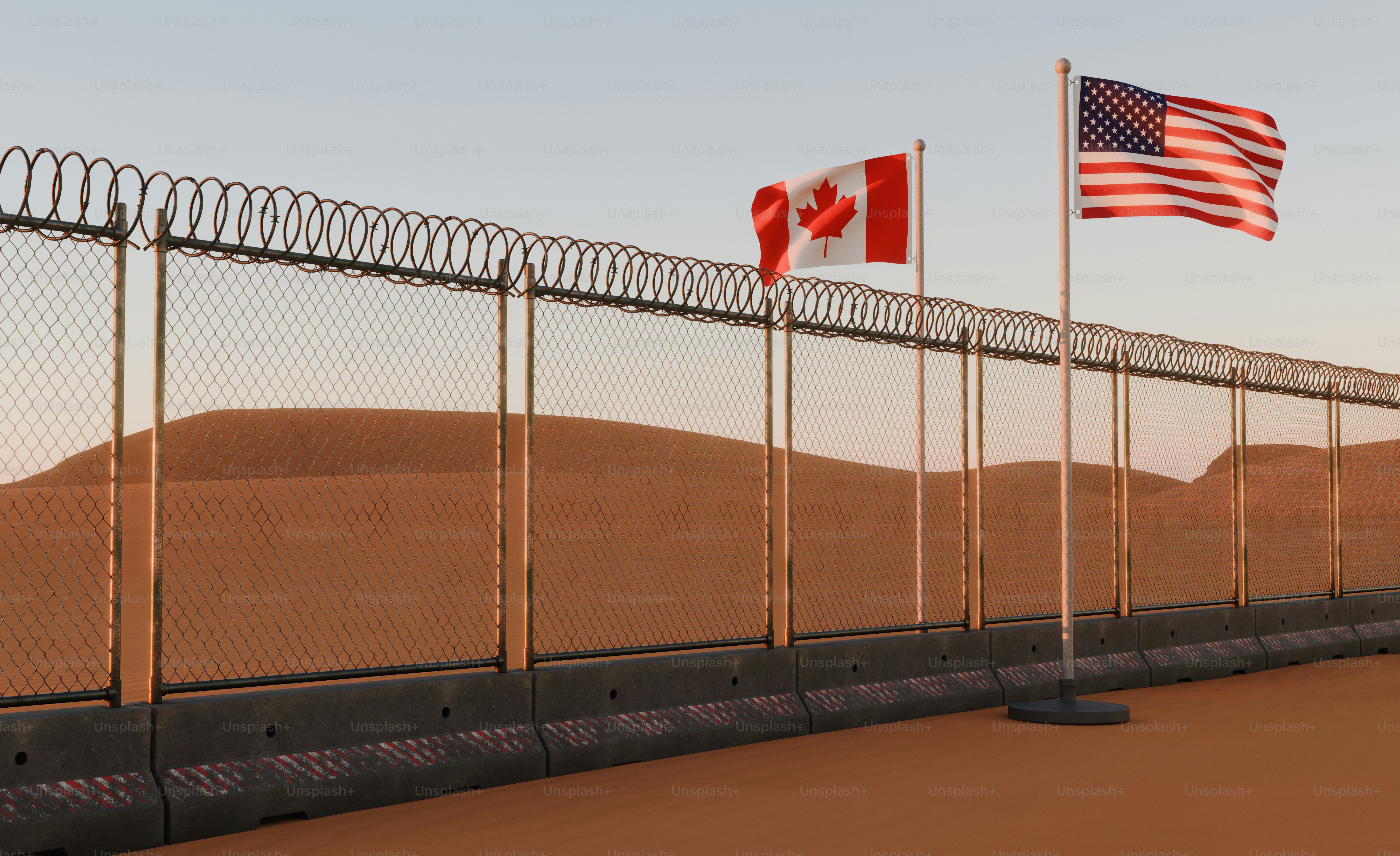 Chain-link border fence with flags - Photo on Unsplash+