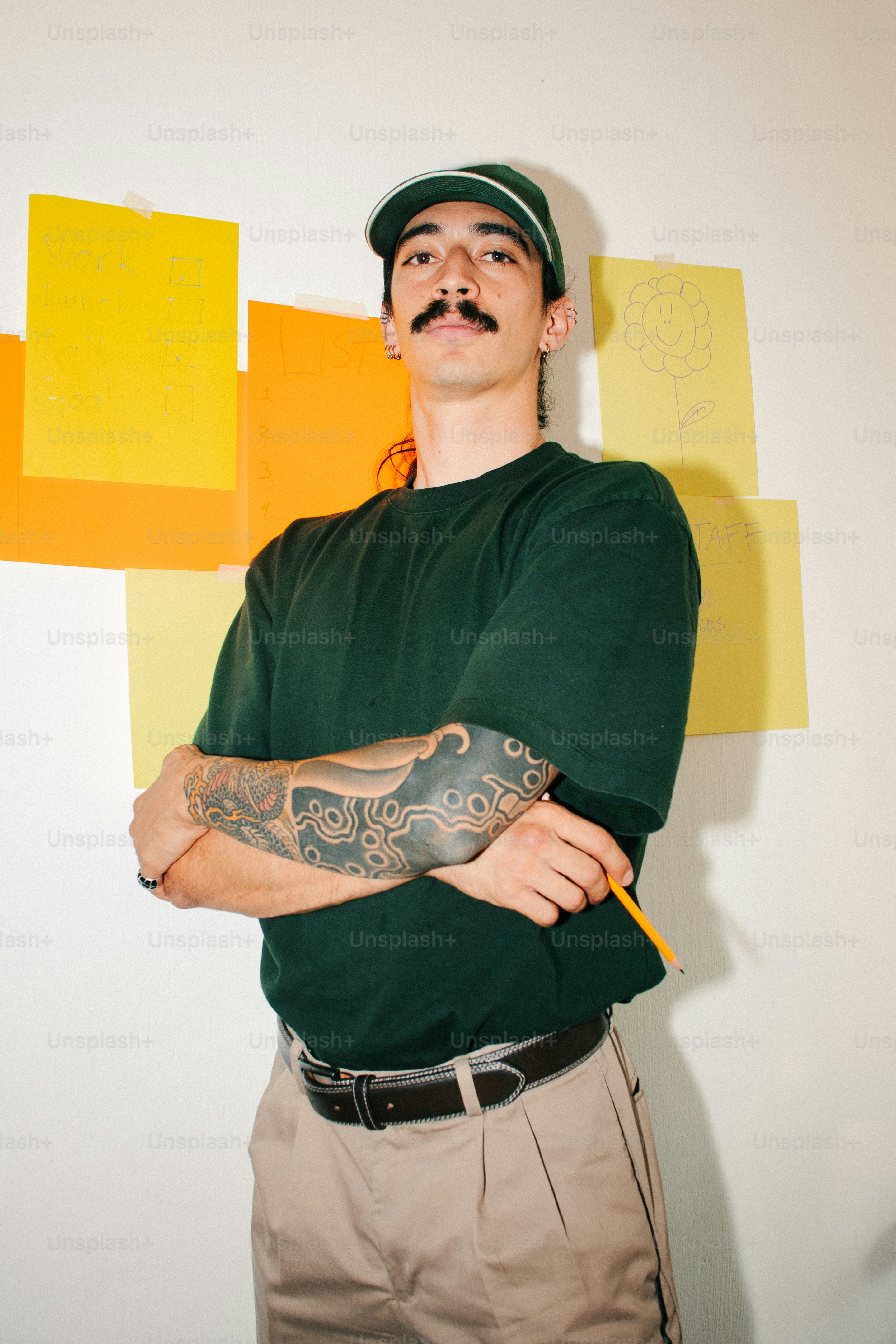 Man with mustache and green shirt - Photo on Unsplash+