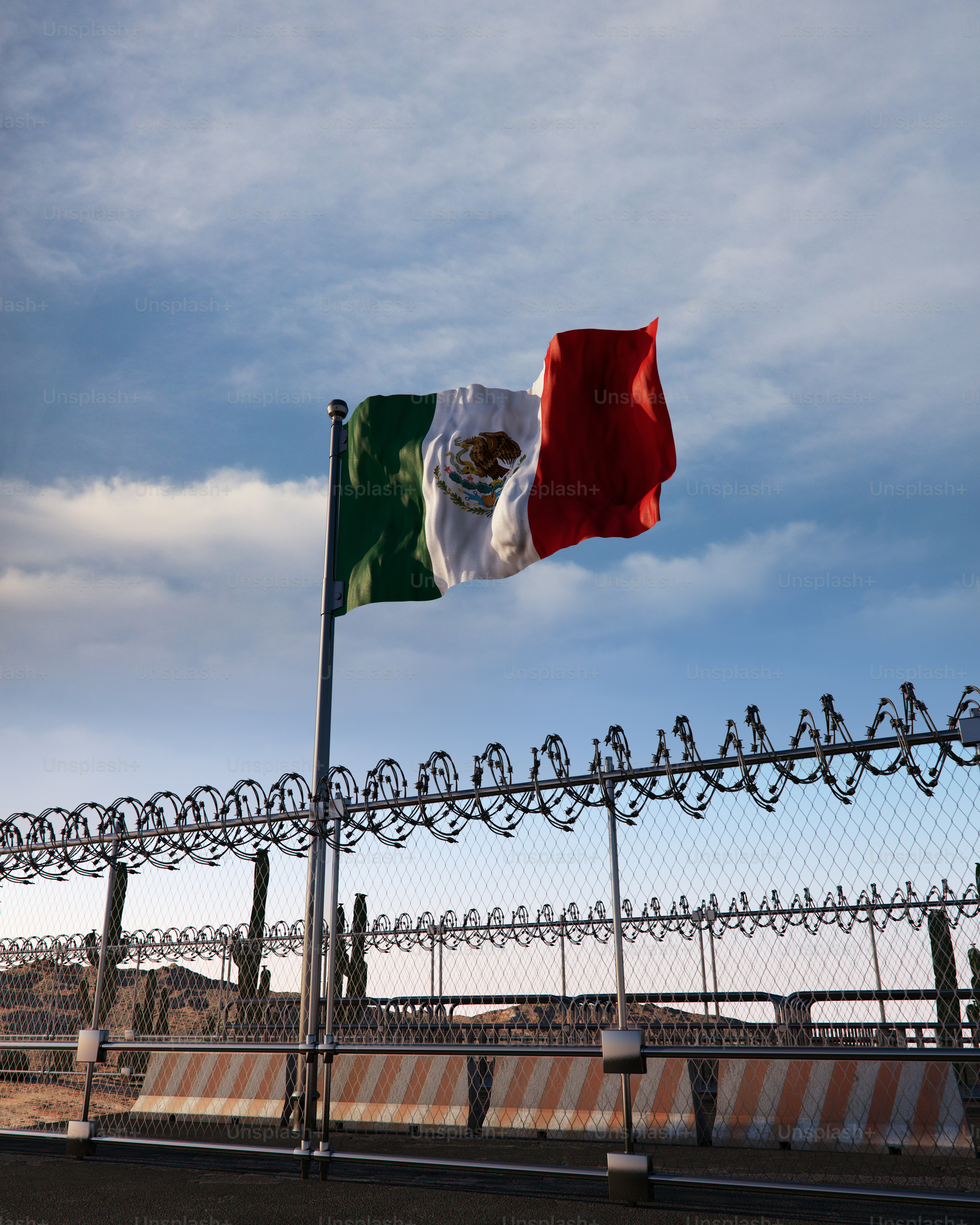 USA-Mexico border sign and fence - Photo on Unsplash+