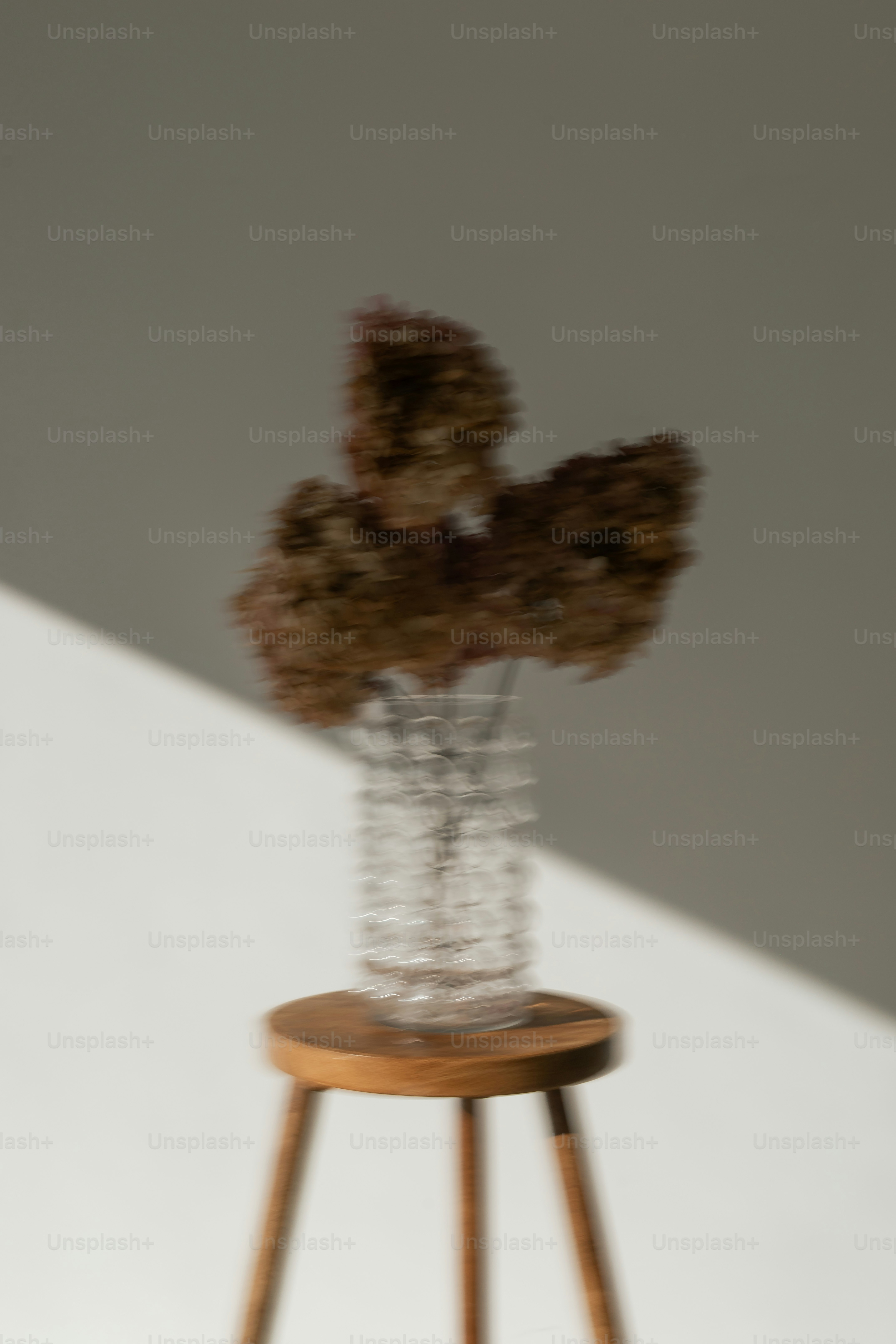 Wooden stool with flowing curtain - Photo on Unsplash+