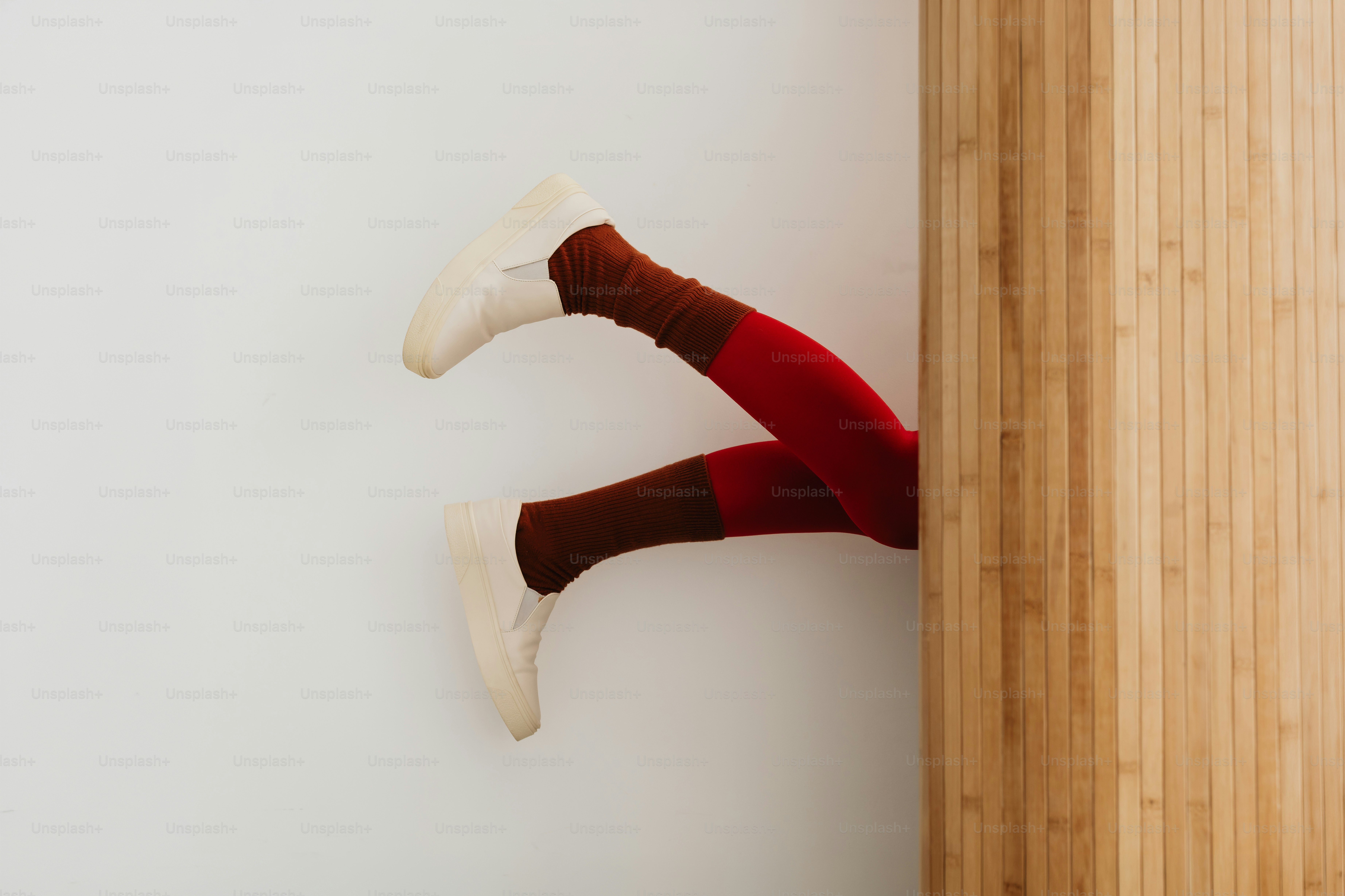 Leg in orange tights and heel - Photo on Unsplash+