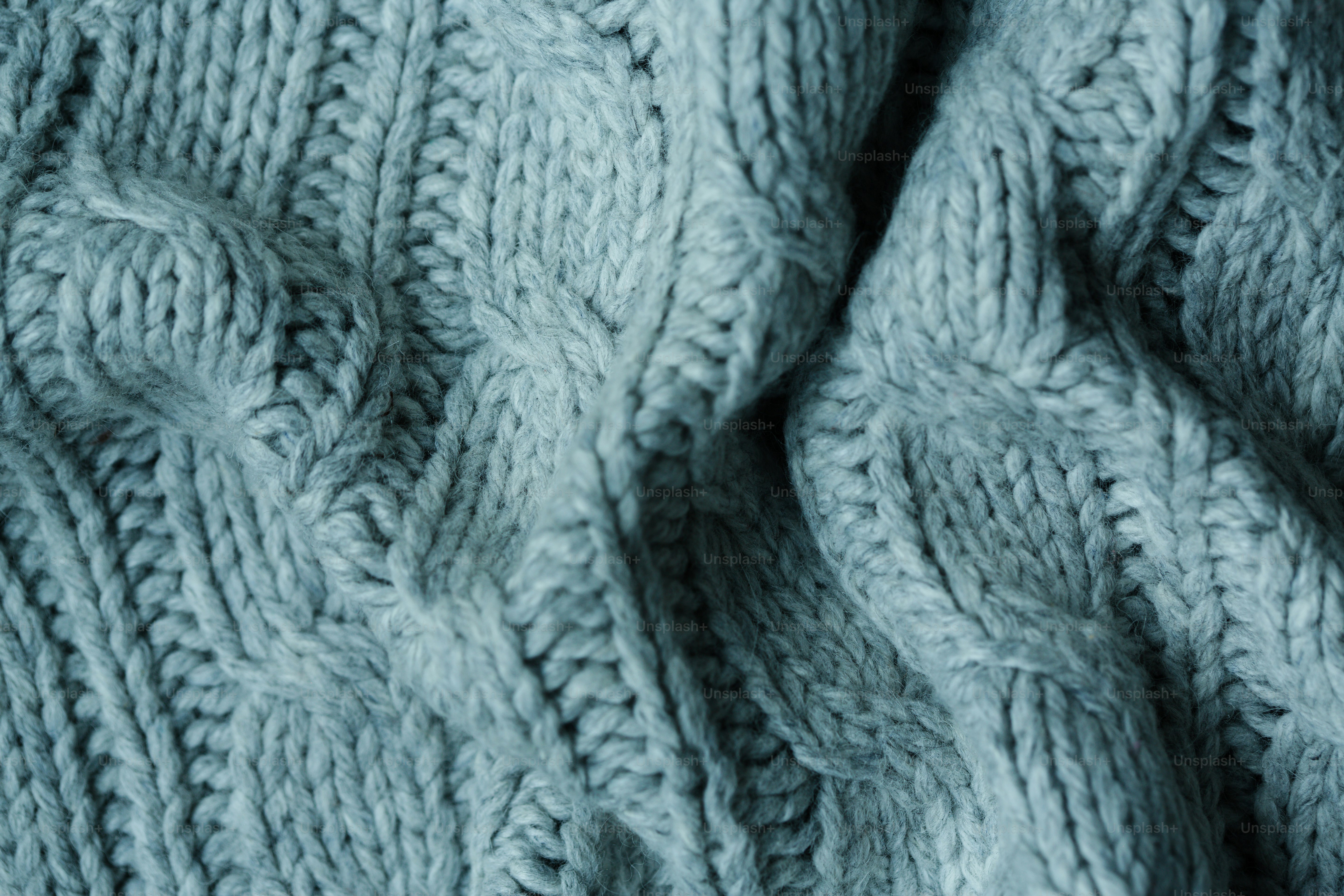 Grey cable knit sweater texture - Photo on Unsplash+