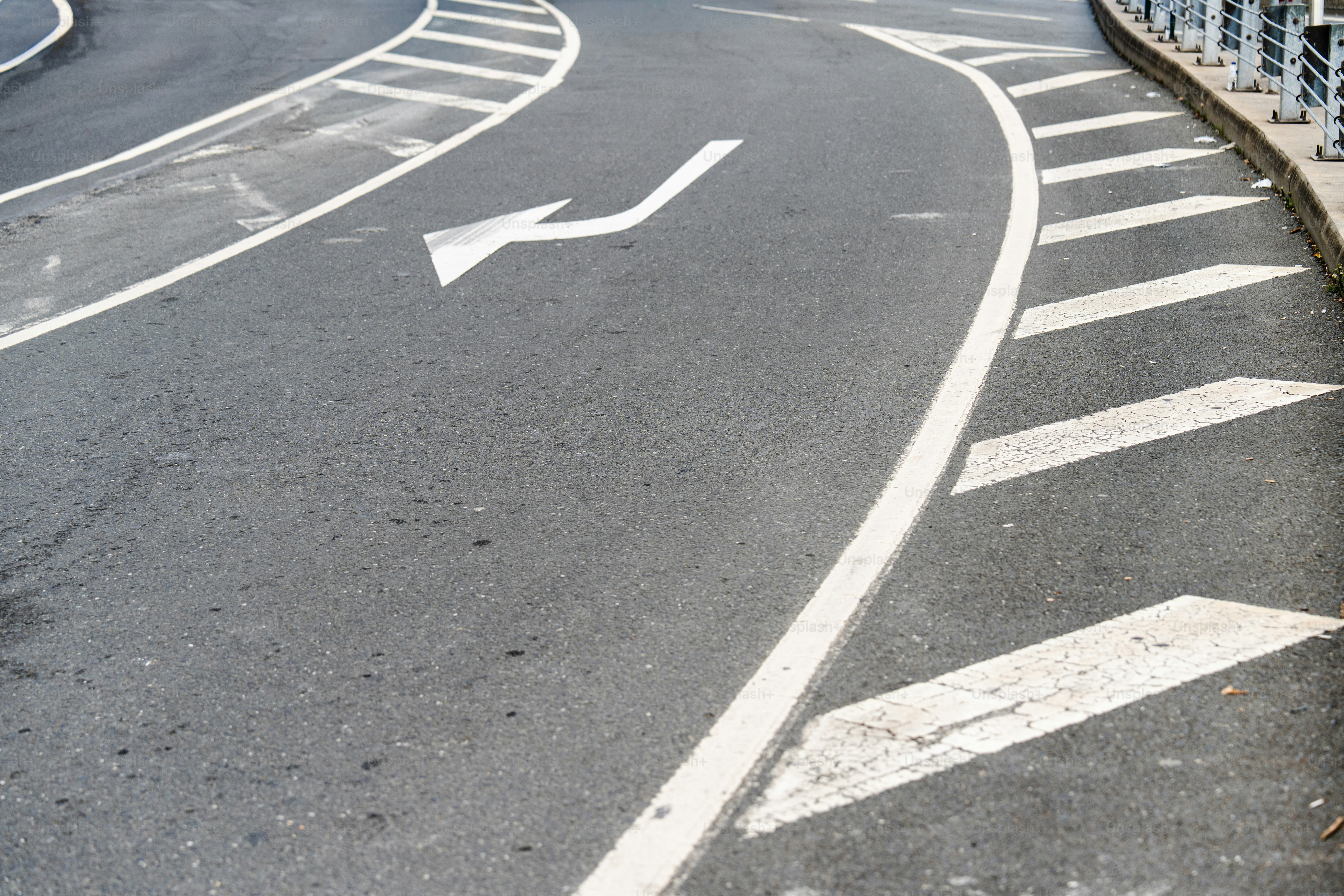 Asphalt highway with white lane markings - Photo on Unsplash+