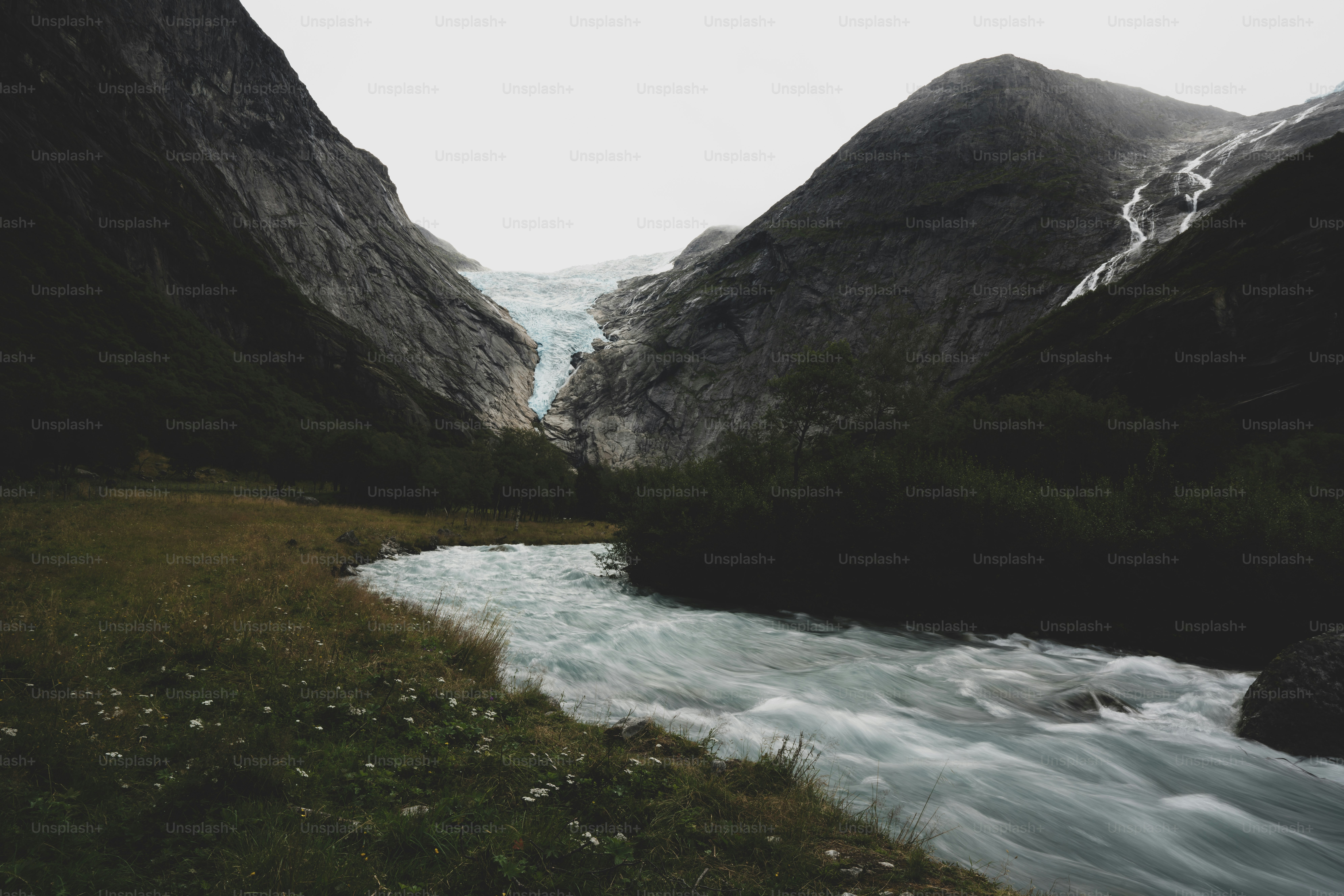 Glacial river in rocky mountain valley - Photo on Unsplash+