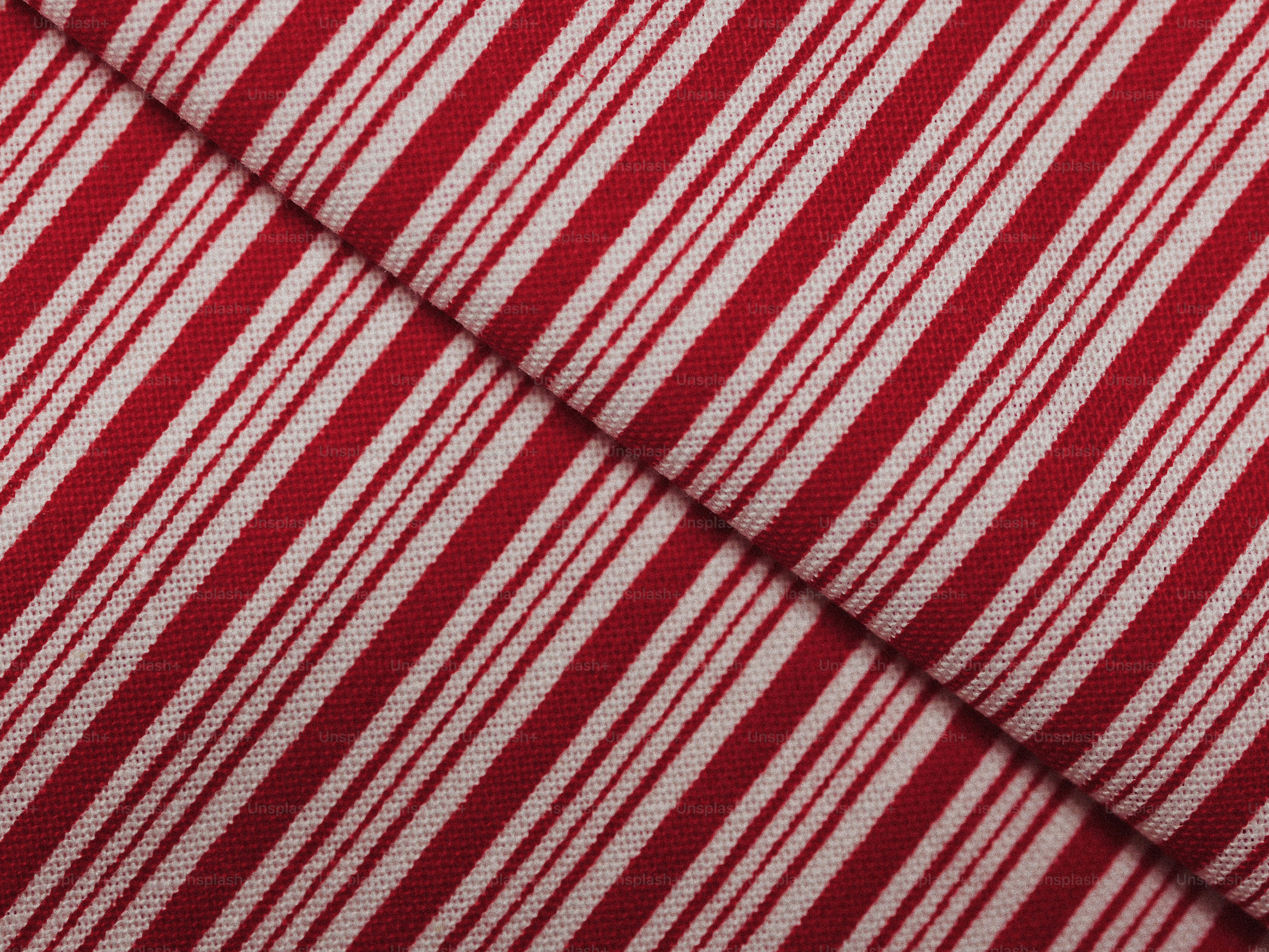 Red and white striped candy canes - Photo on Unsplash+