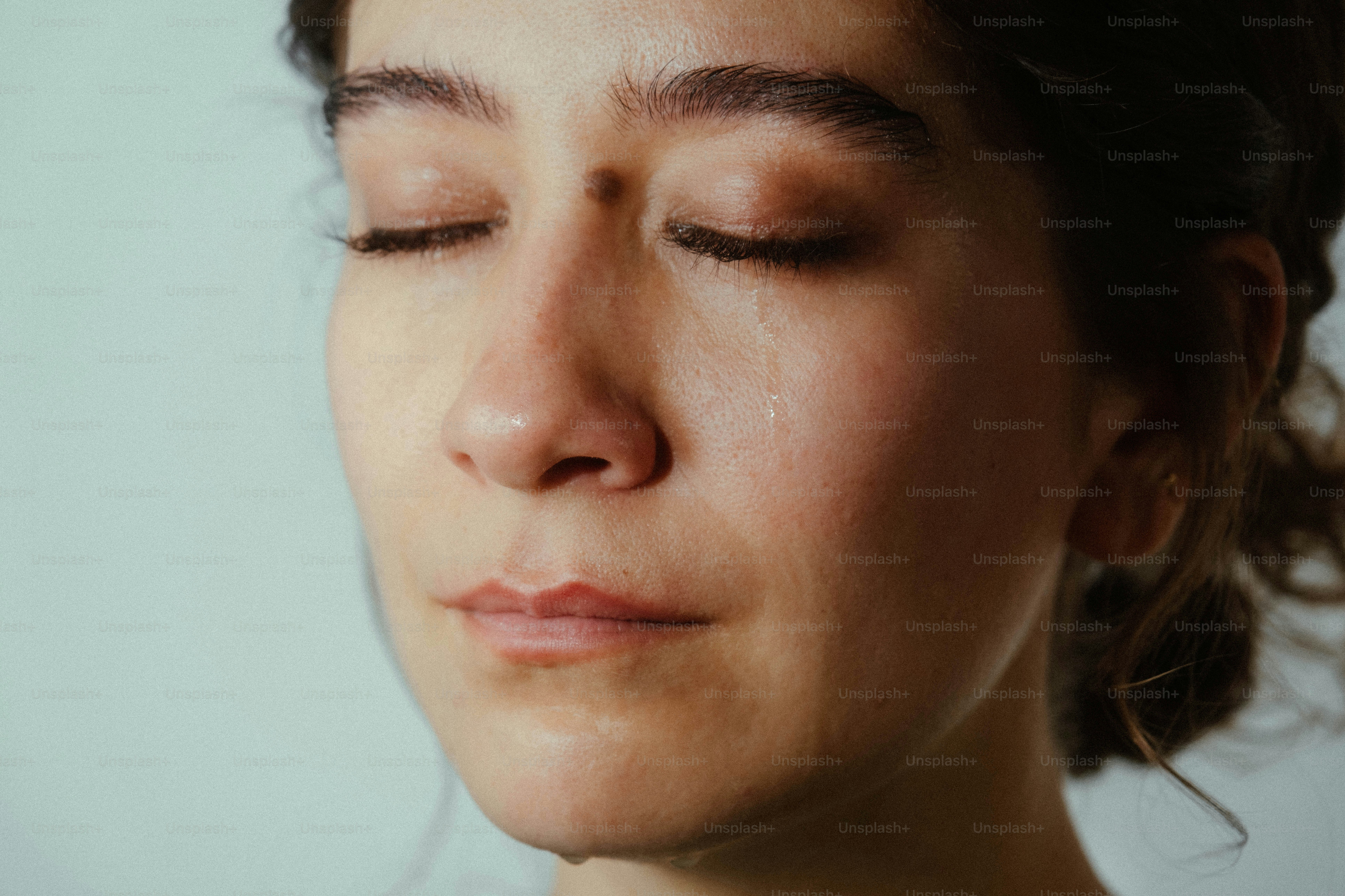Woman smiling with closed eyes - Photo on Unsplash+