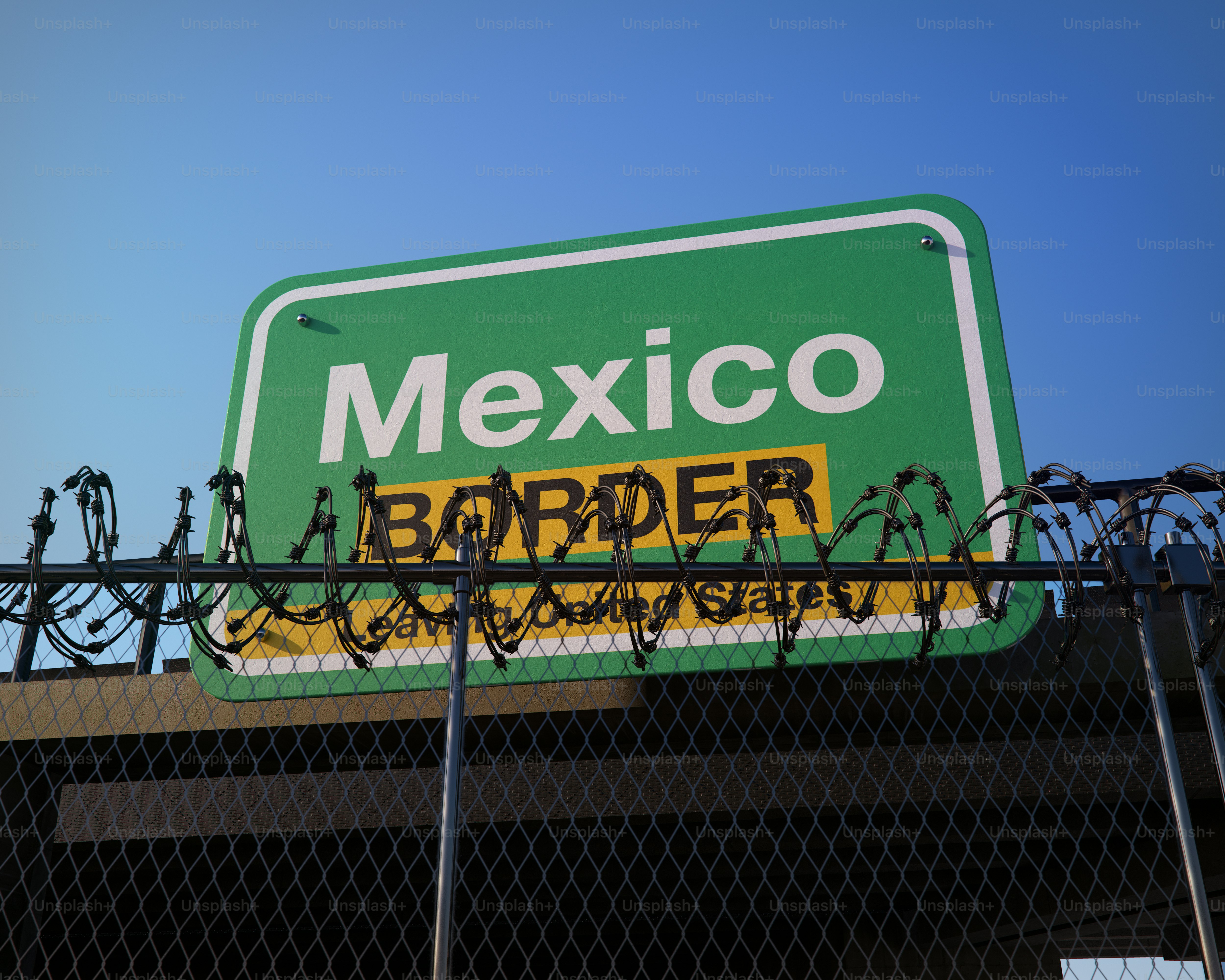 Mexico border sign with barbed fence - Photo on Unsplash+