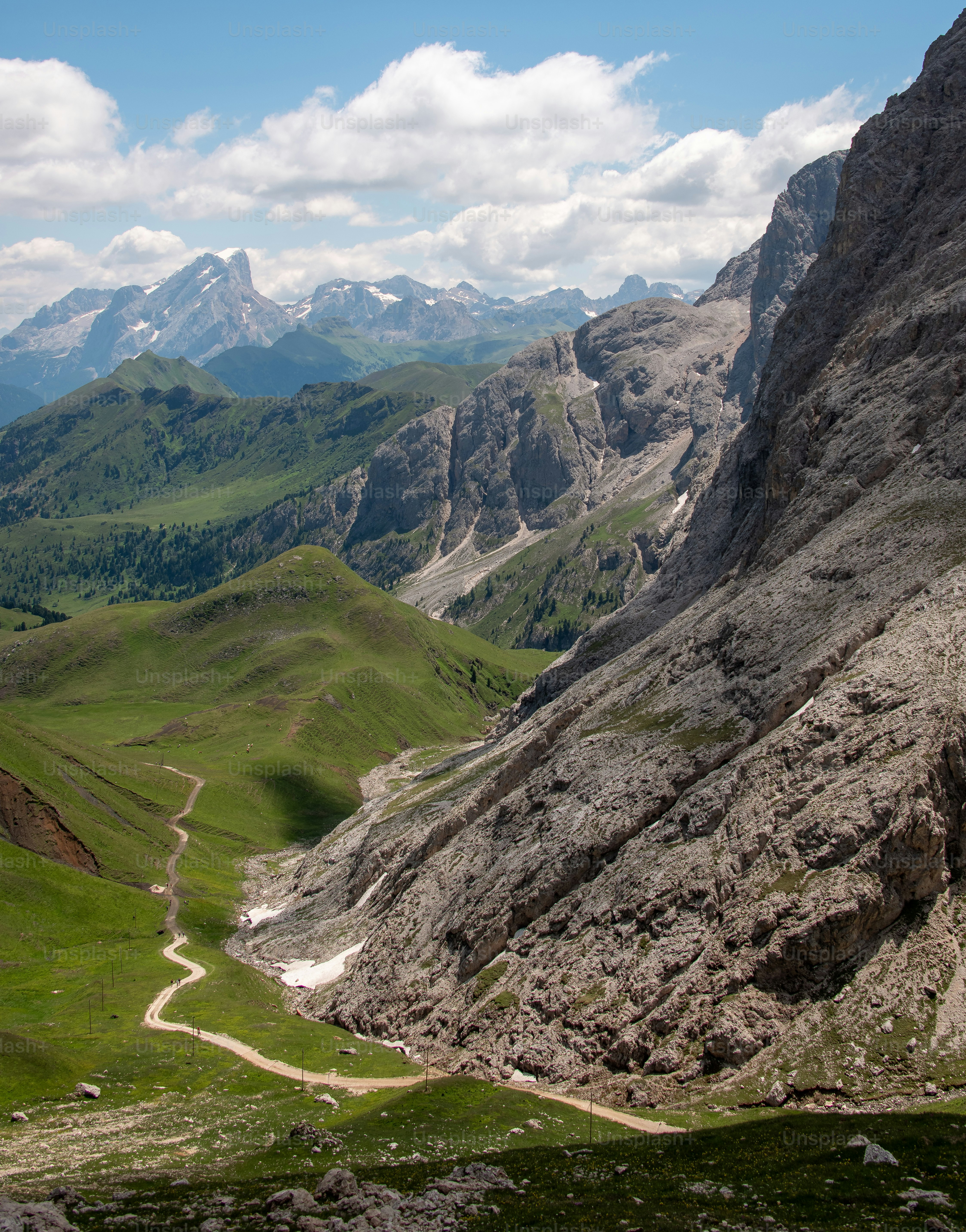 Gravel path toward mountain forest - Photo on Unsplash+