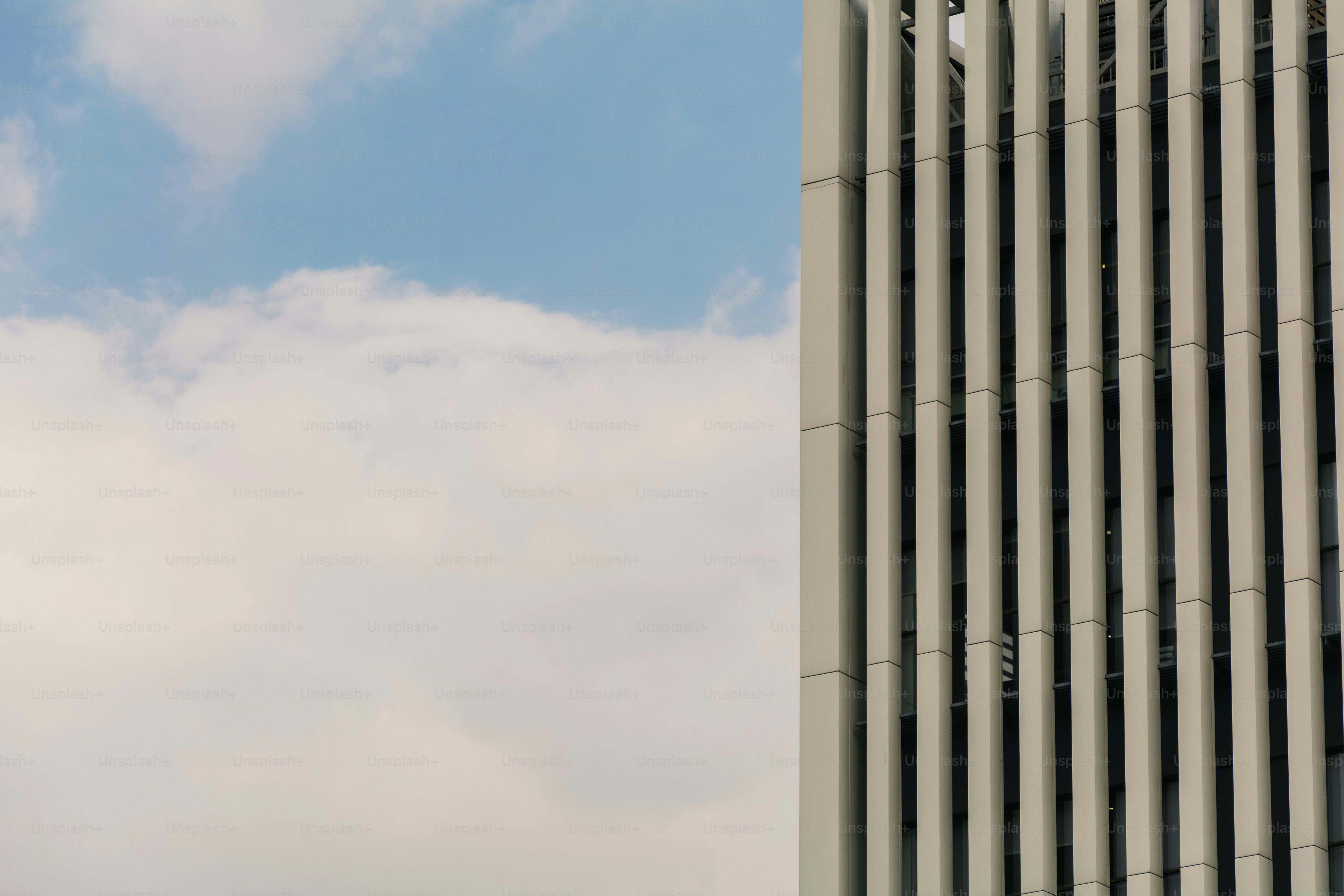 Modern skyscraper facade with vertical fins - Photo on Unsplash+