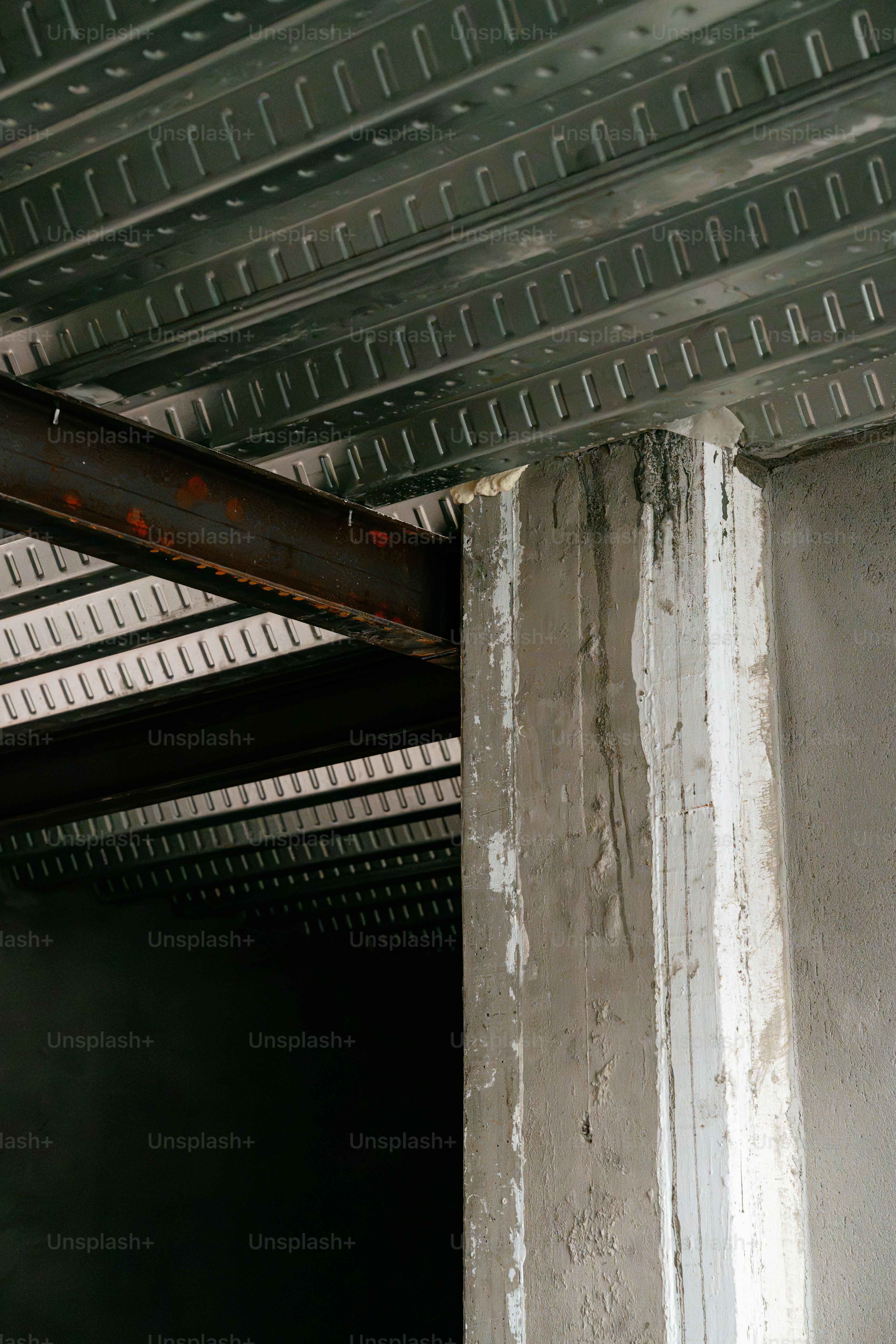 Steel beam and concrete pillar - Photo on Unsplash+