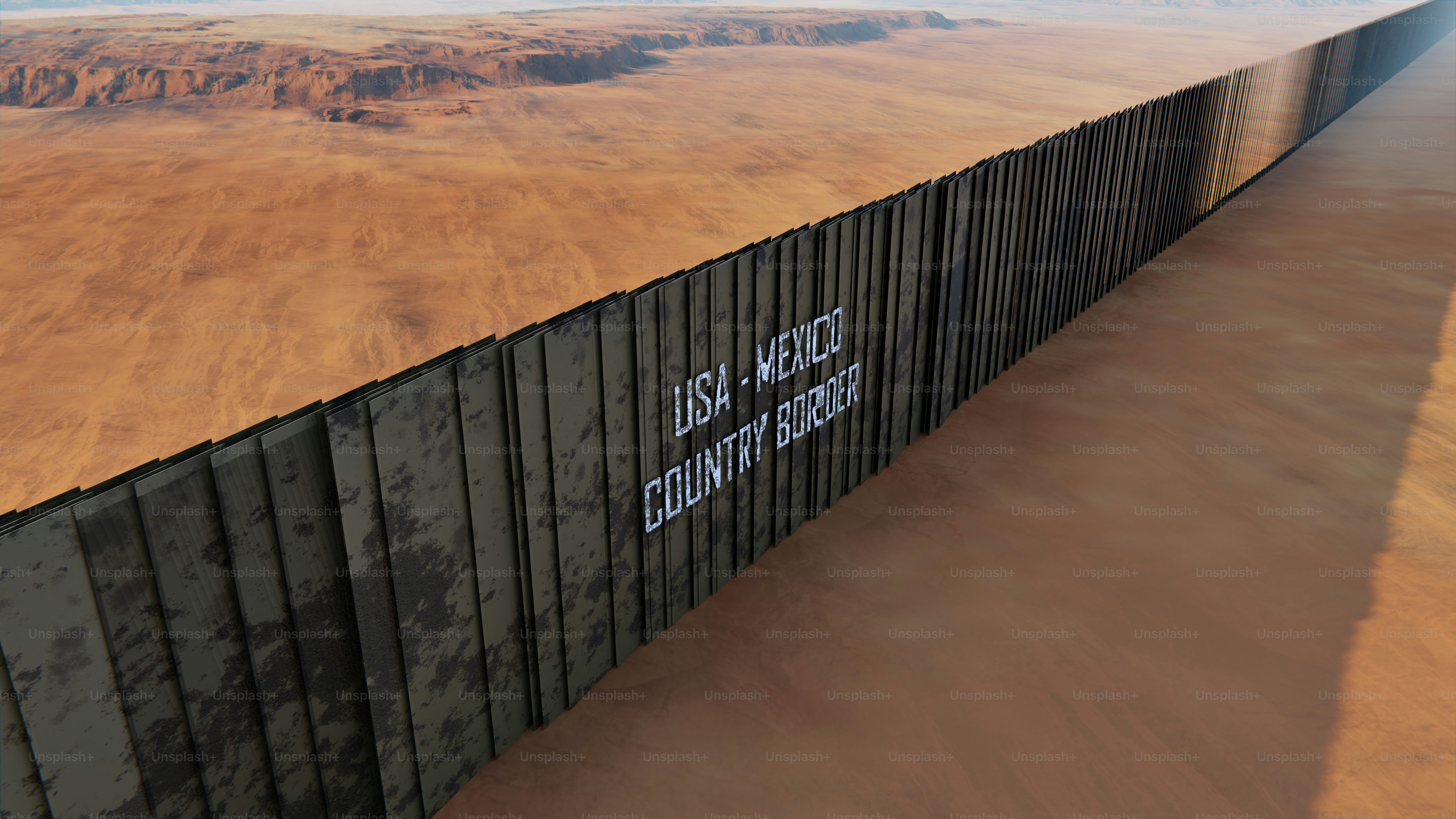 Metal border wall in desert landscape - Photo on Unsplash+