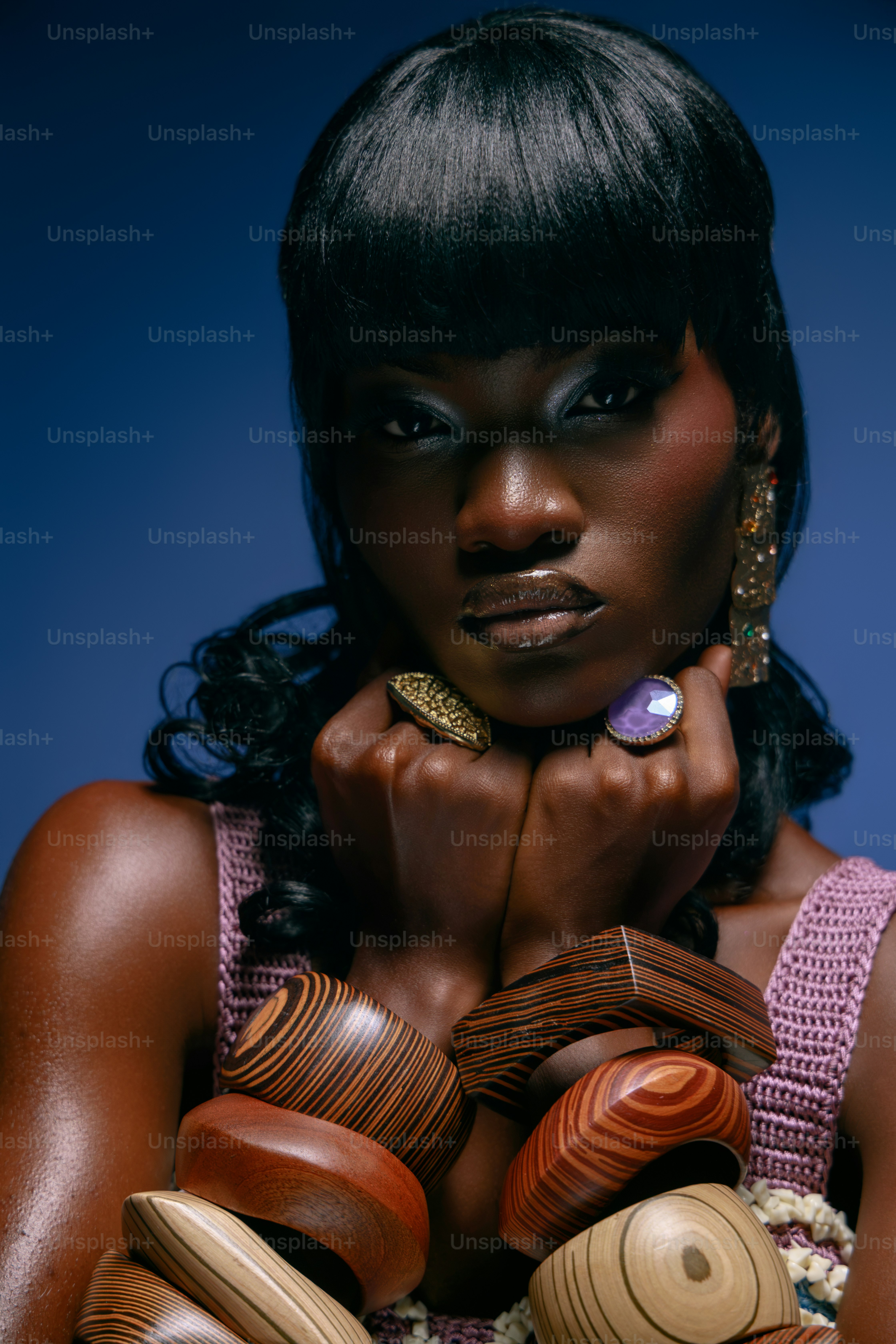 Woman wearing wooden bangles and rings - Photo on Unsplash+