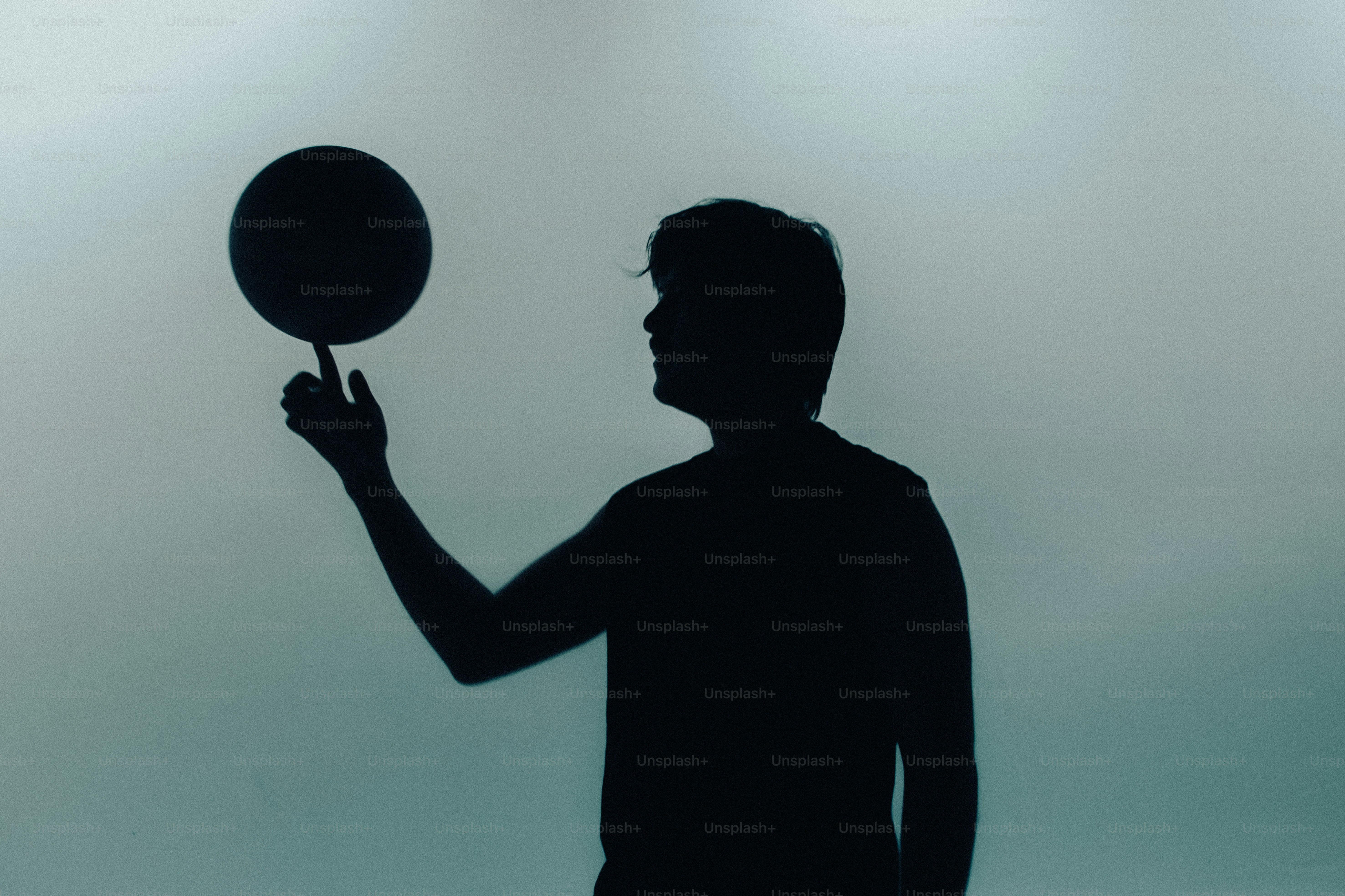 Person in silhouette throwing punch - Photo on Unsplash+