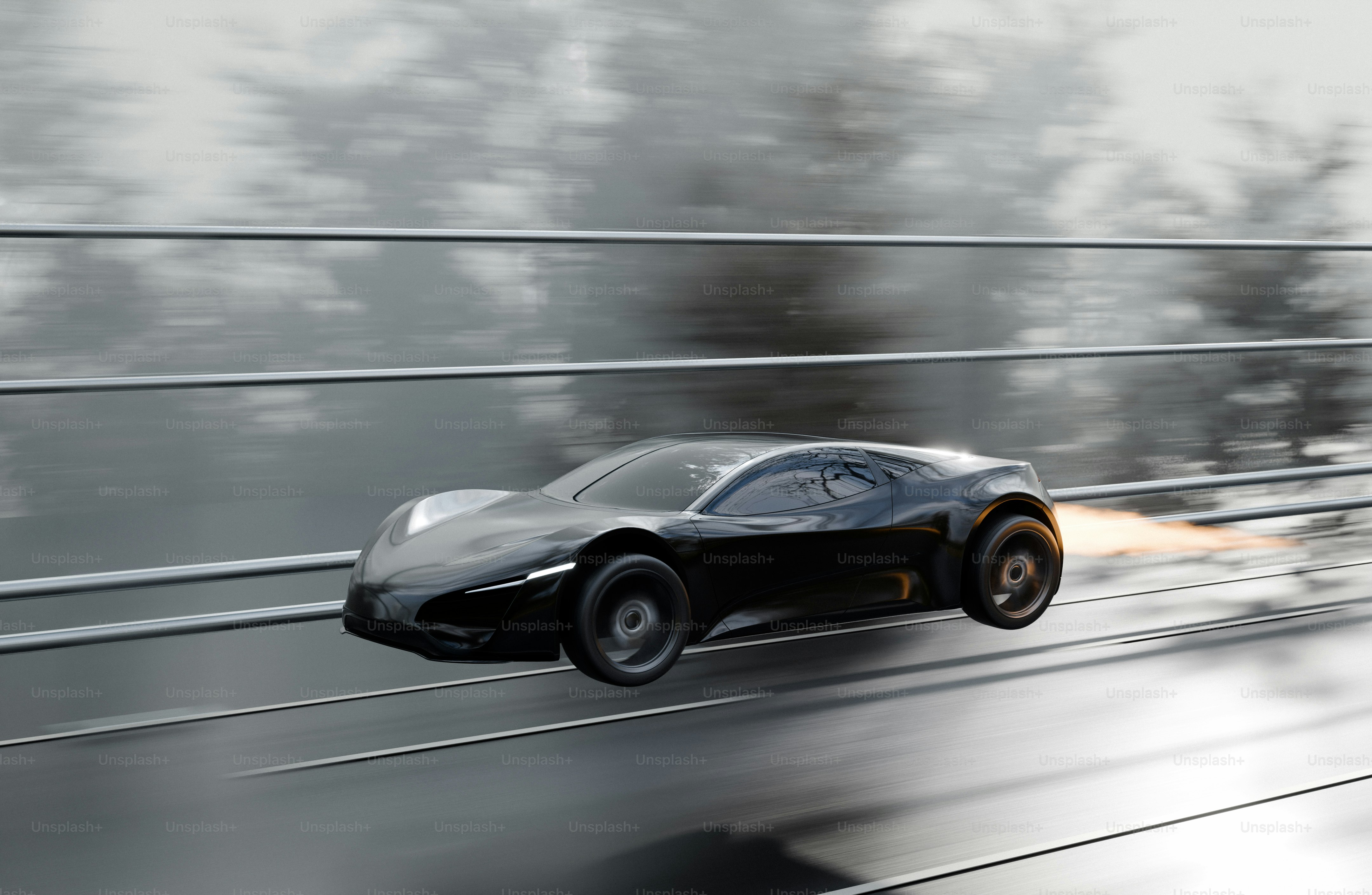 Black sports car speeding on road - Photo on Unsplash+