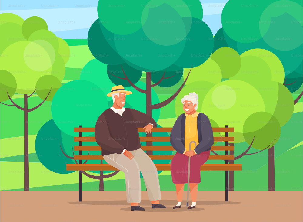 Old woman and man are resting and sitting on bench in park. Grandmother with cane smiling at man in hat. Rendezvous of retirees from nursing home. Elderly people spend time talking together outdoors