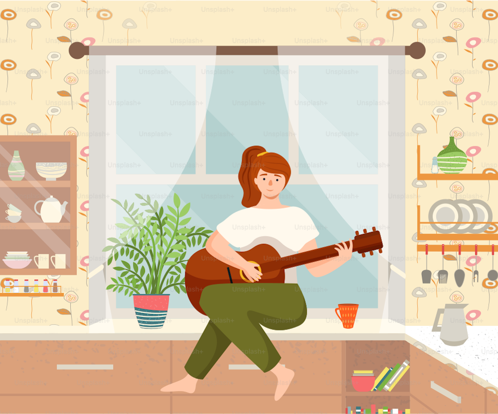 Woman is playing the guitar sitting on the kitchen table. Musician composes songs and sings at home. Female character makes music indoor. Person is fond of creativity sings songs, hobby time relaxing