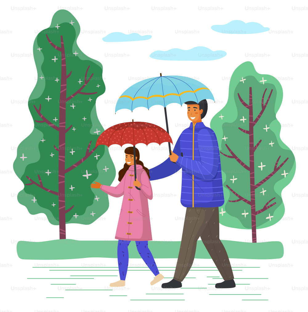 Father and daughter spend time together on a rainy october day move down the street past tall trees. Family walking in the rain with umbrella and wearing raincoats in the city park in autumn season.