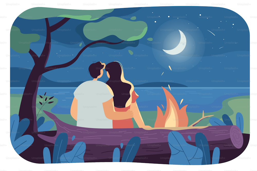 Couple tourists sitting and hugging in forest and looking at stars, moon and night sky near bonfire. Girl and boy having romantic evening near lake. Romance, landscape, relationship, love concept