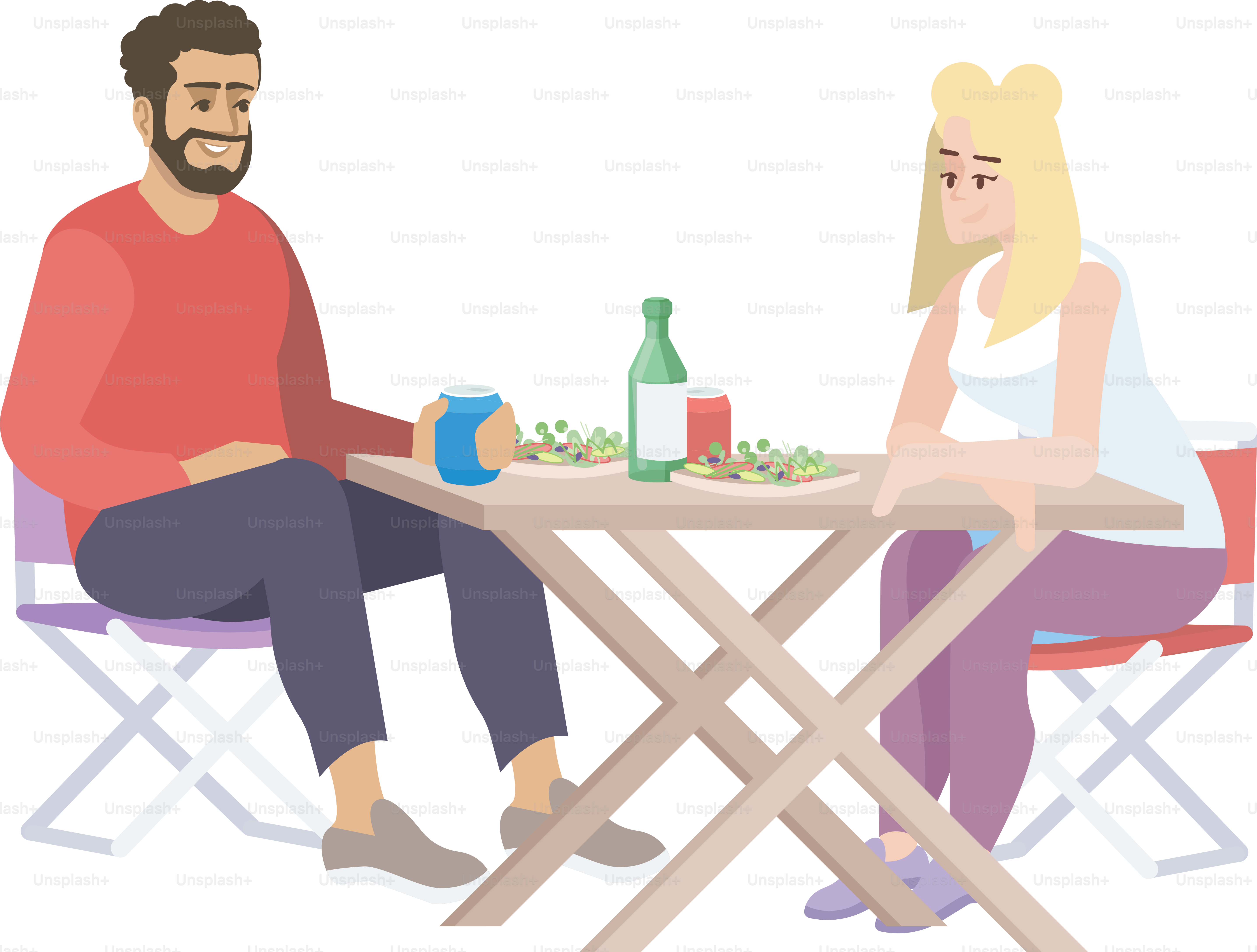 食べ物と飲み物を並べたテーブルに座る男女