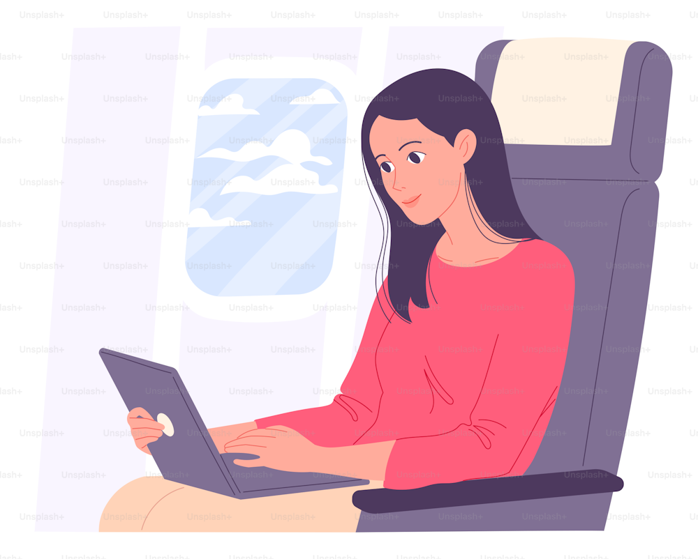 Woman with laptop in airplane works during flight.