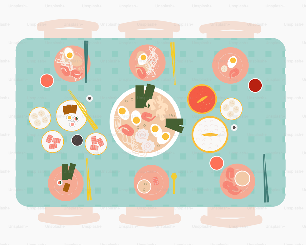 une table surmontée d’un bol de soupe et de baguettes