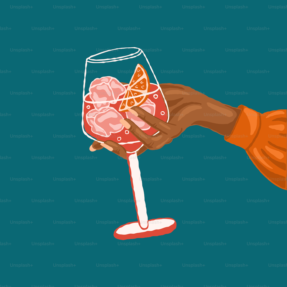 a hand holding a wine glass filled with orange slices