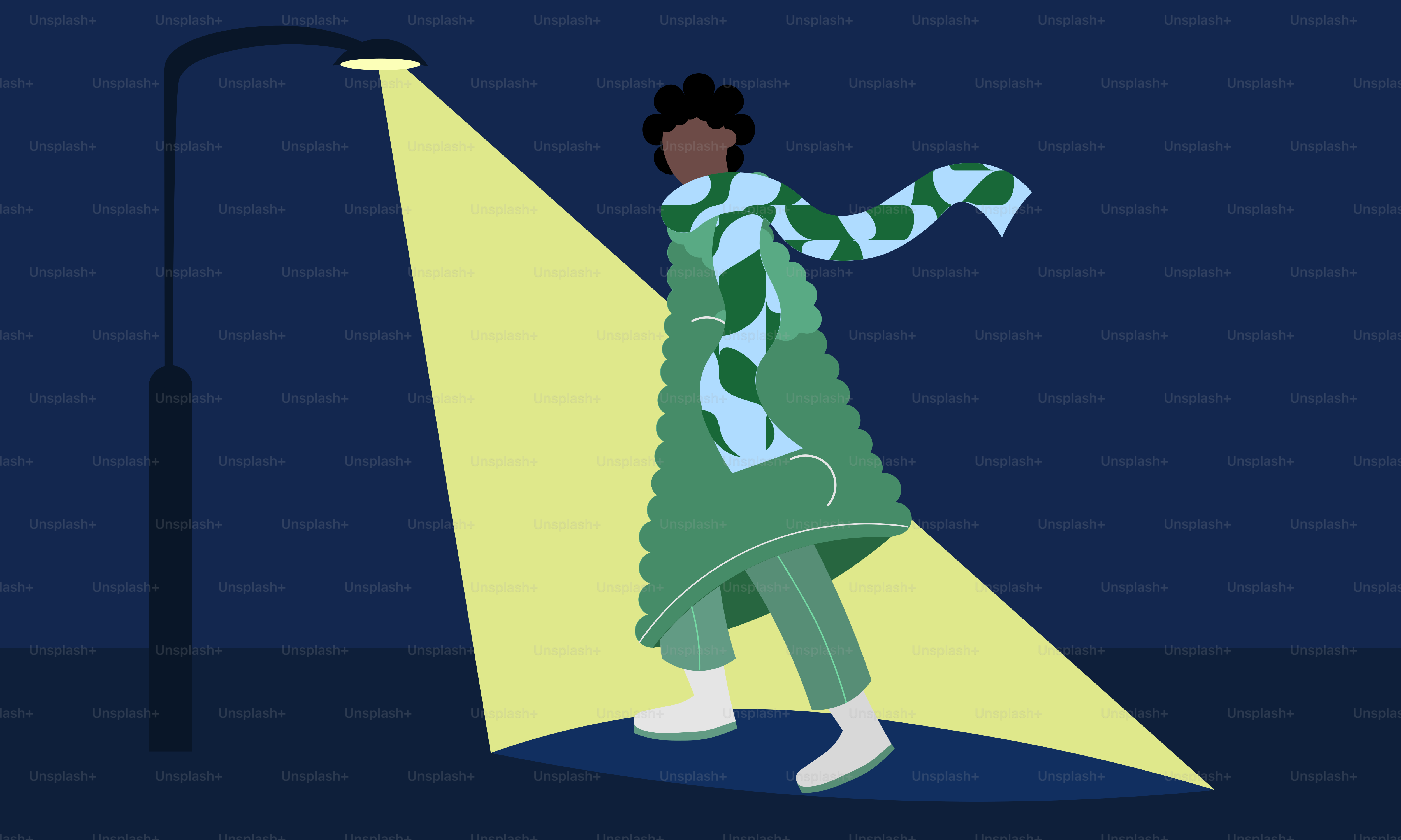 Person walking in the light of a streetlamp at night