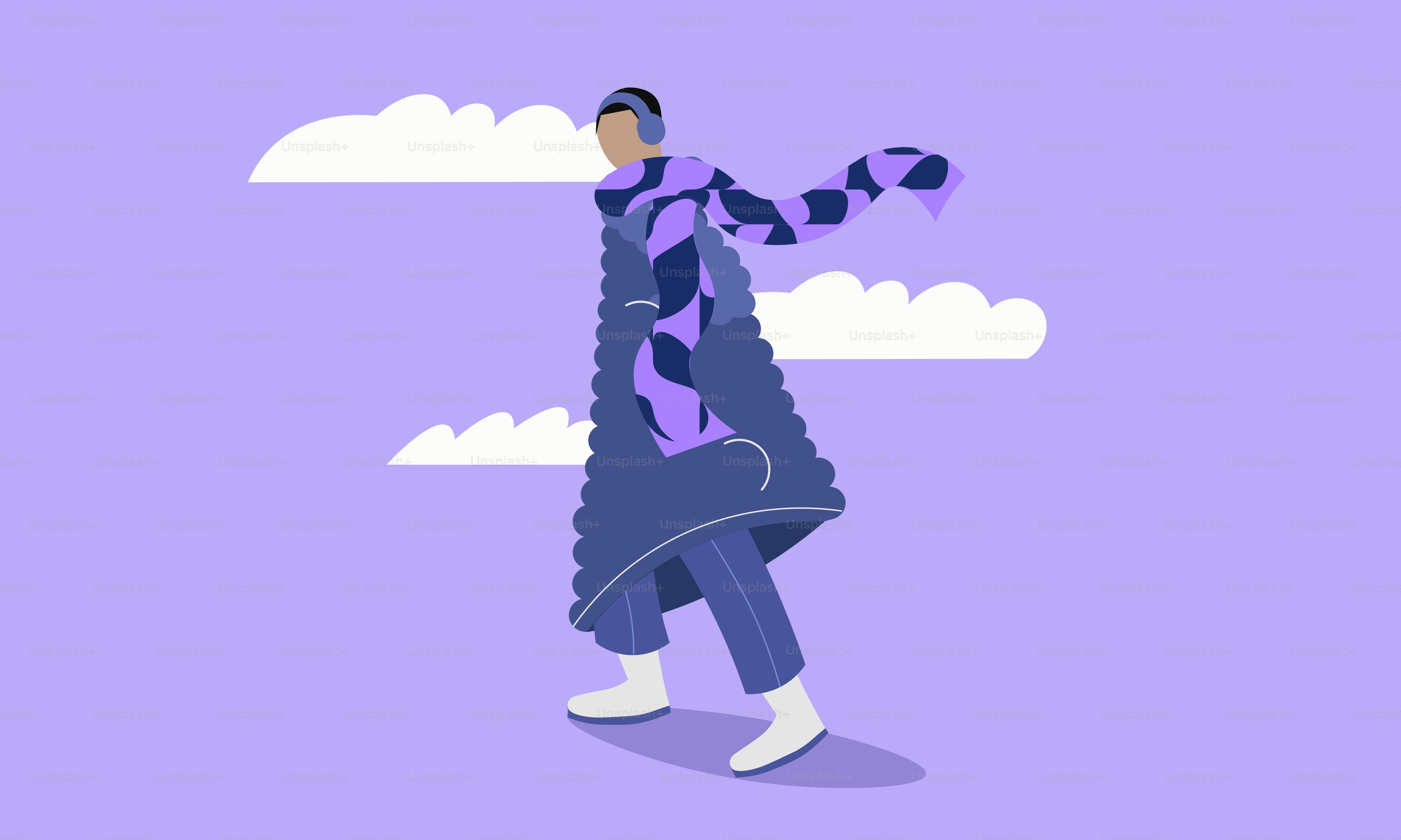 Person in stylish winter coat and scarf walks.