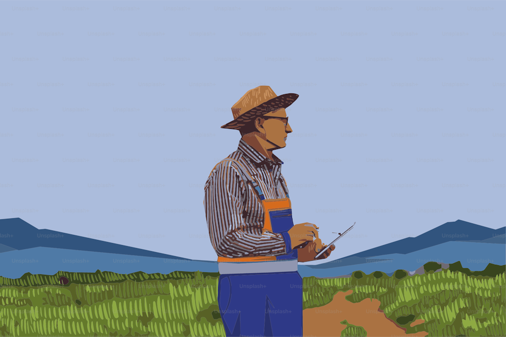 L'uomo bianco, giardiniere è in piedi e guardando il computer della compressa nel campo della pianta.
